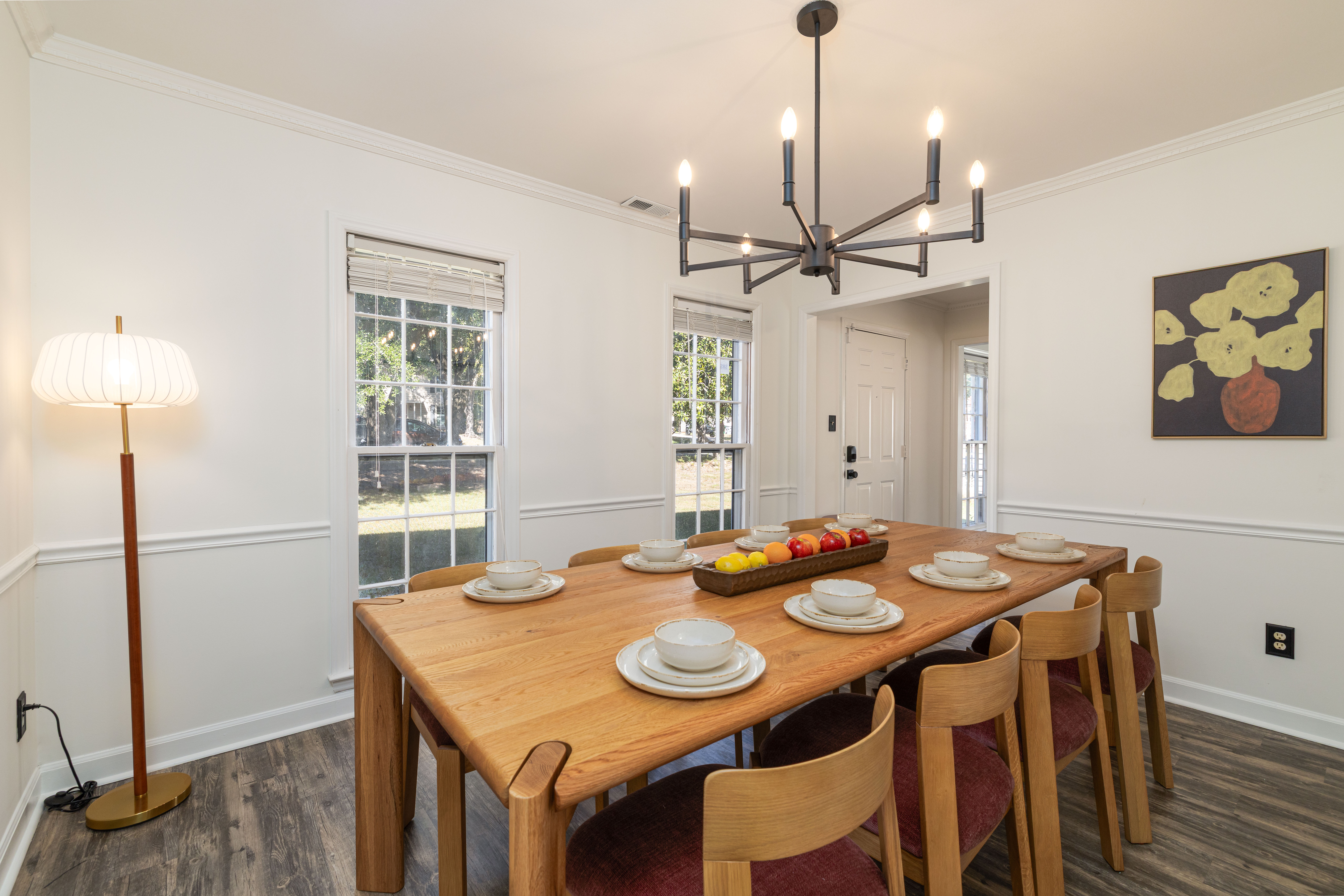 Dining room with seating for 8 and a floor lamp