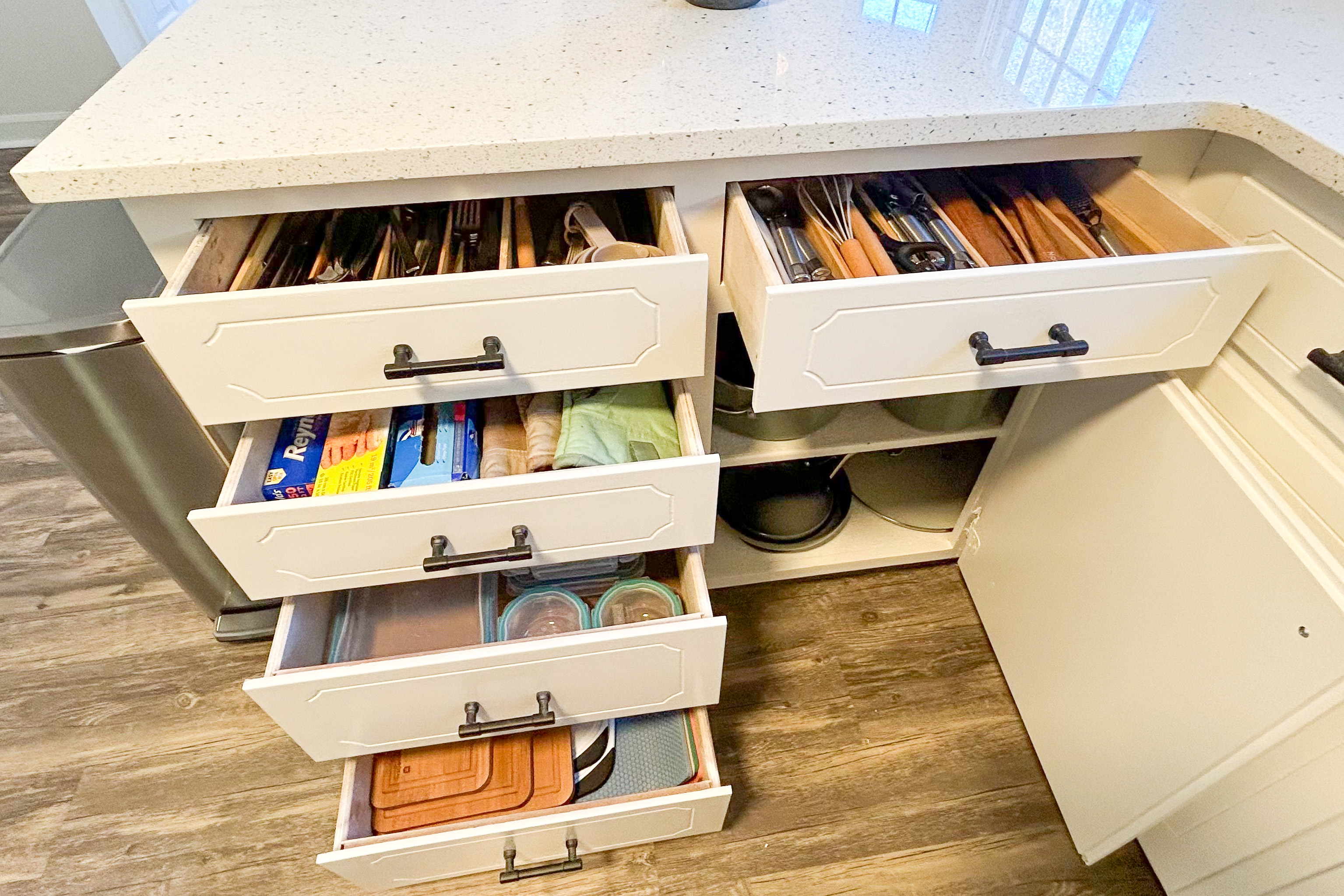Kitchen island drawers with utensils, wrap and prep tools