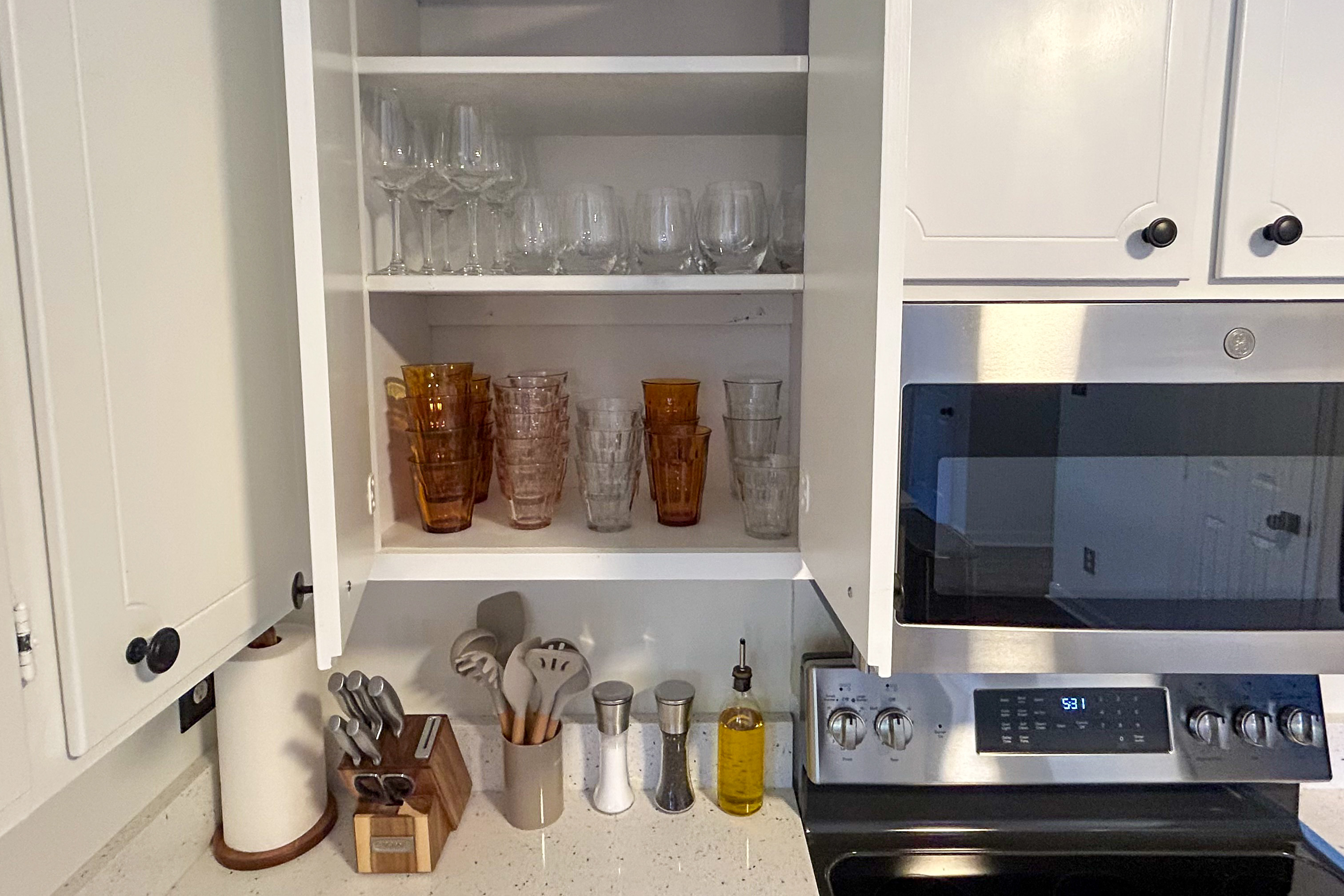Glassware cabinet with Duralex tumblers, amber glasses and wine glasses