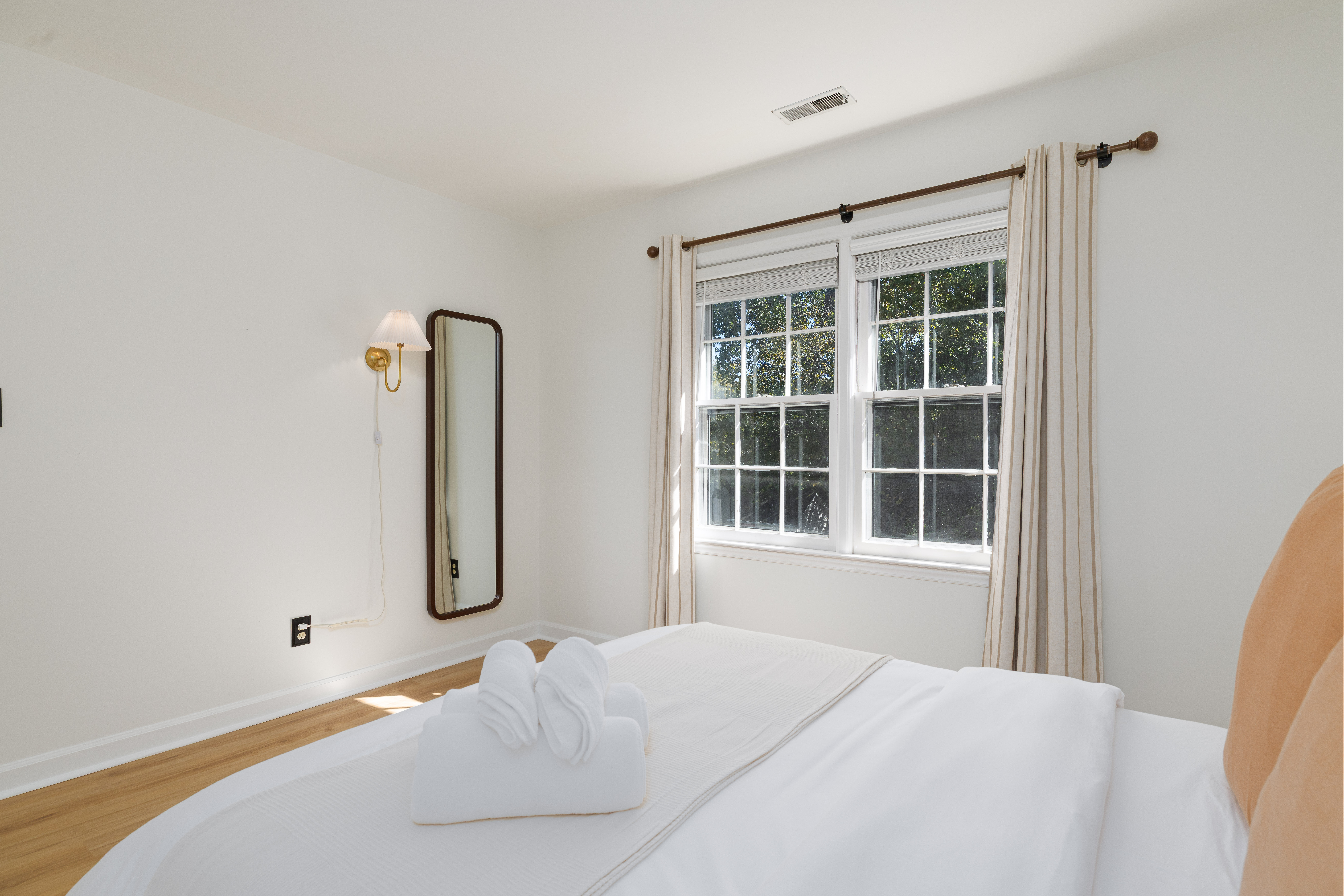 Bedroom 2: queen bed, blackout curtains and full-length mirror