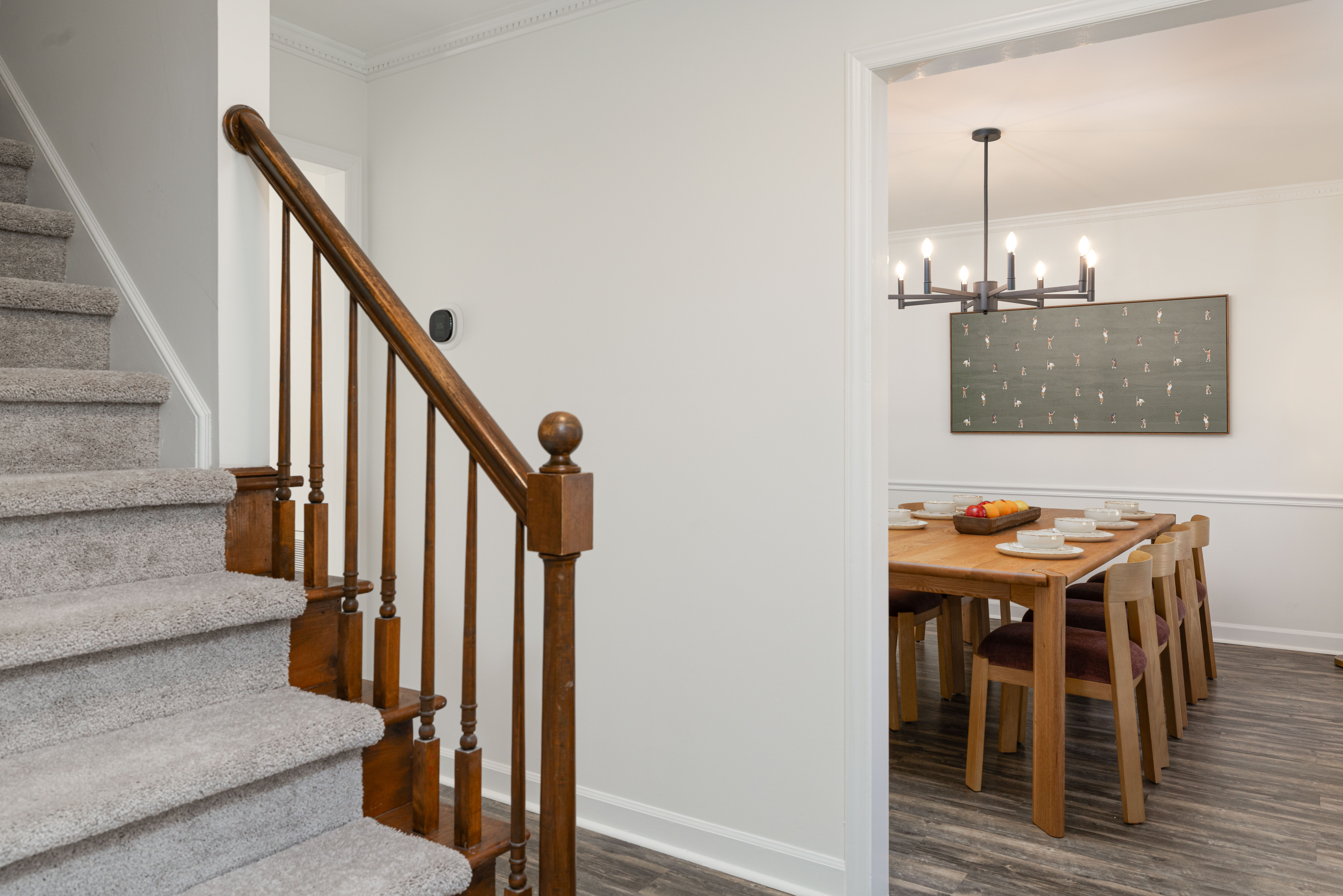 Entry hall with the stairs up to the bedrooms, and the dining room beyond