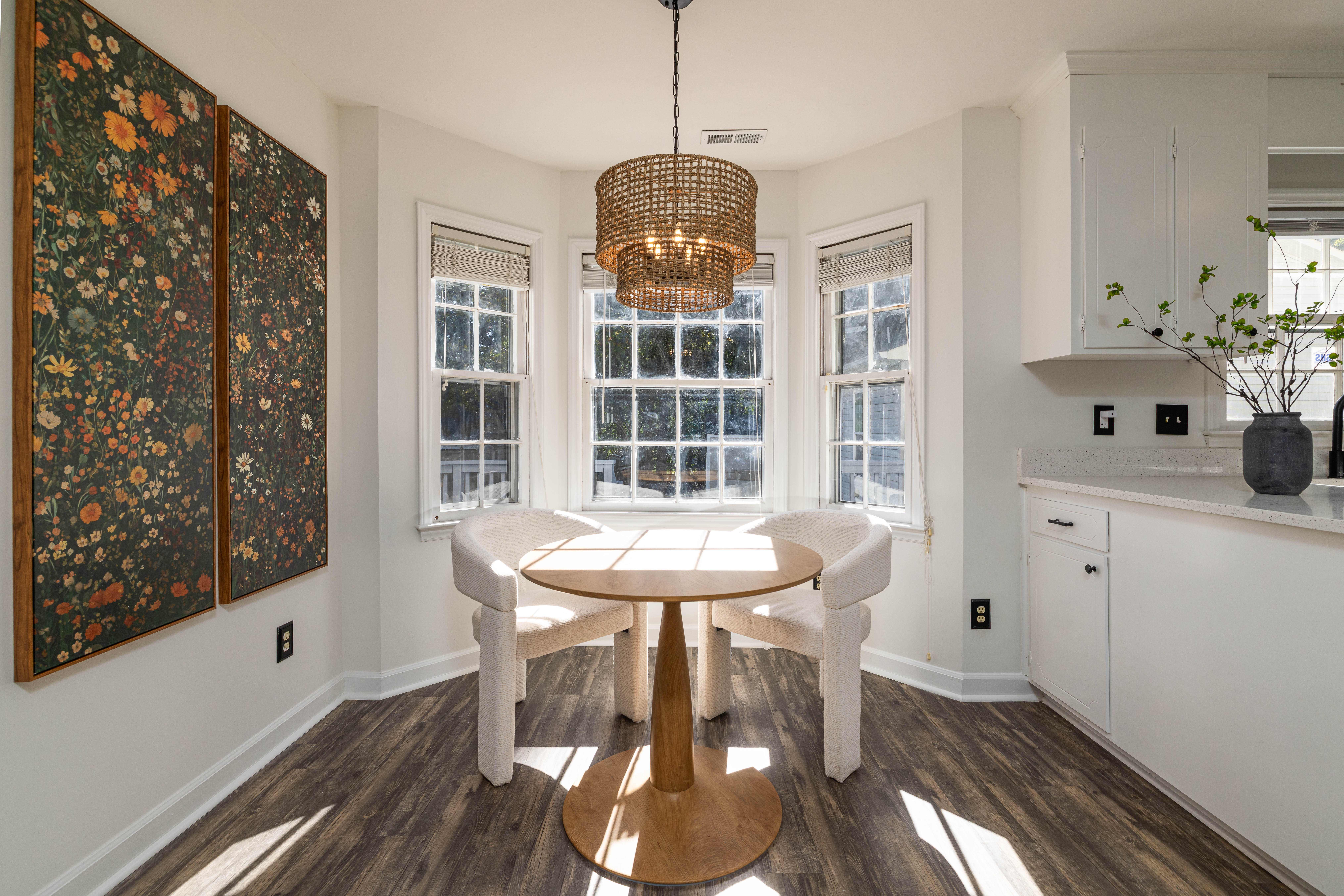 Breakfast nook with bay windows and a pendant light
