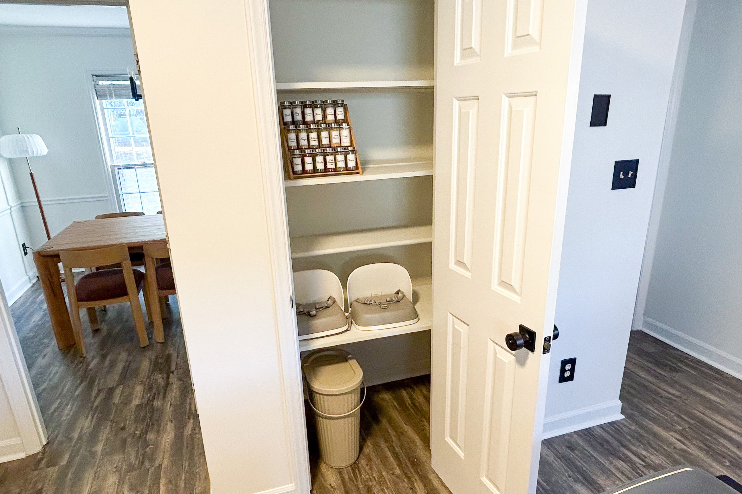 Pantry with a full spice rack and booster seats