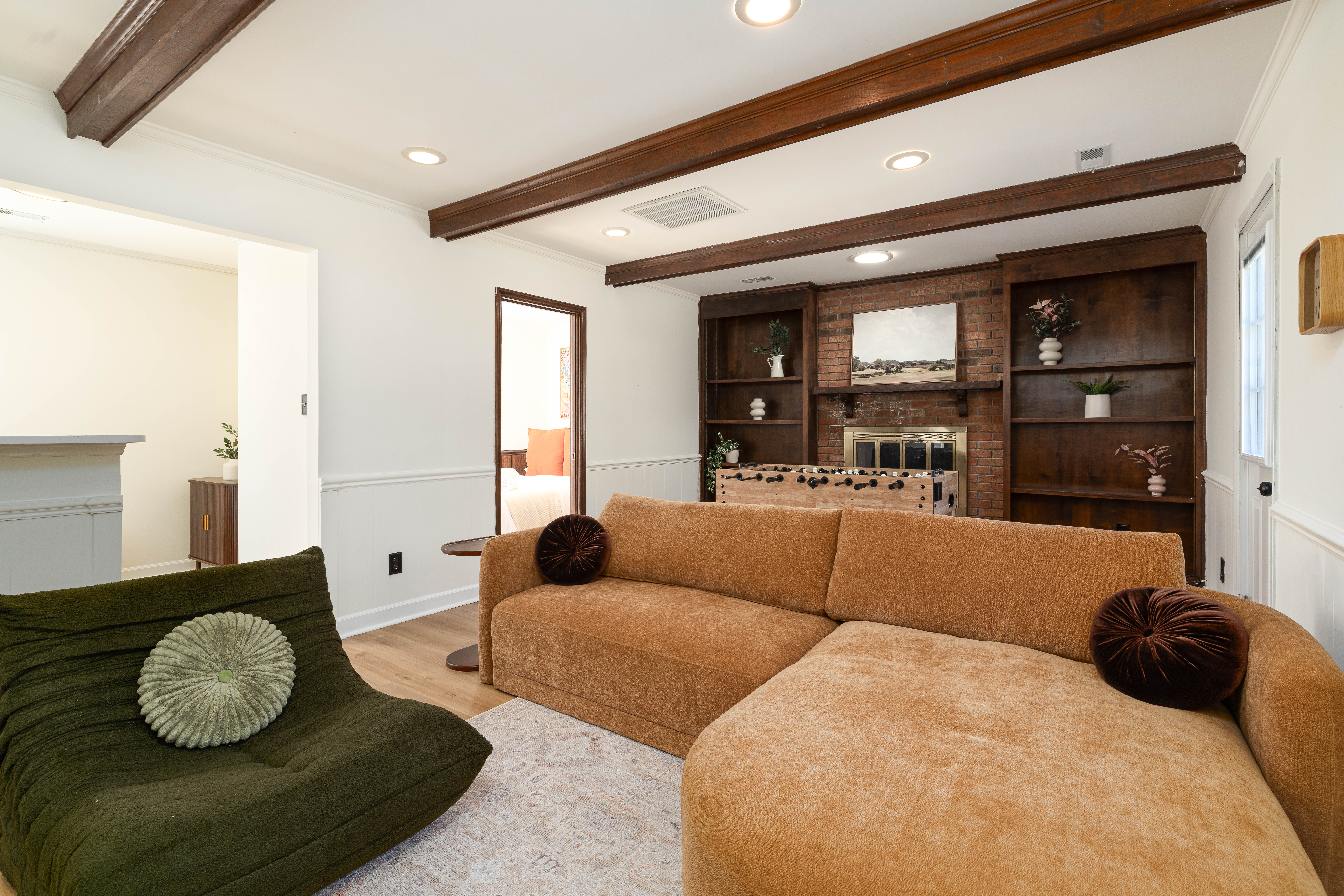 Family room with a deep sectional and a green bean bag