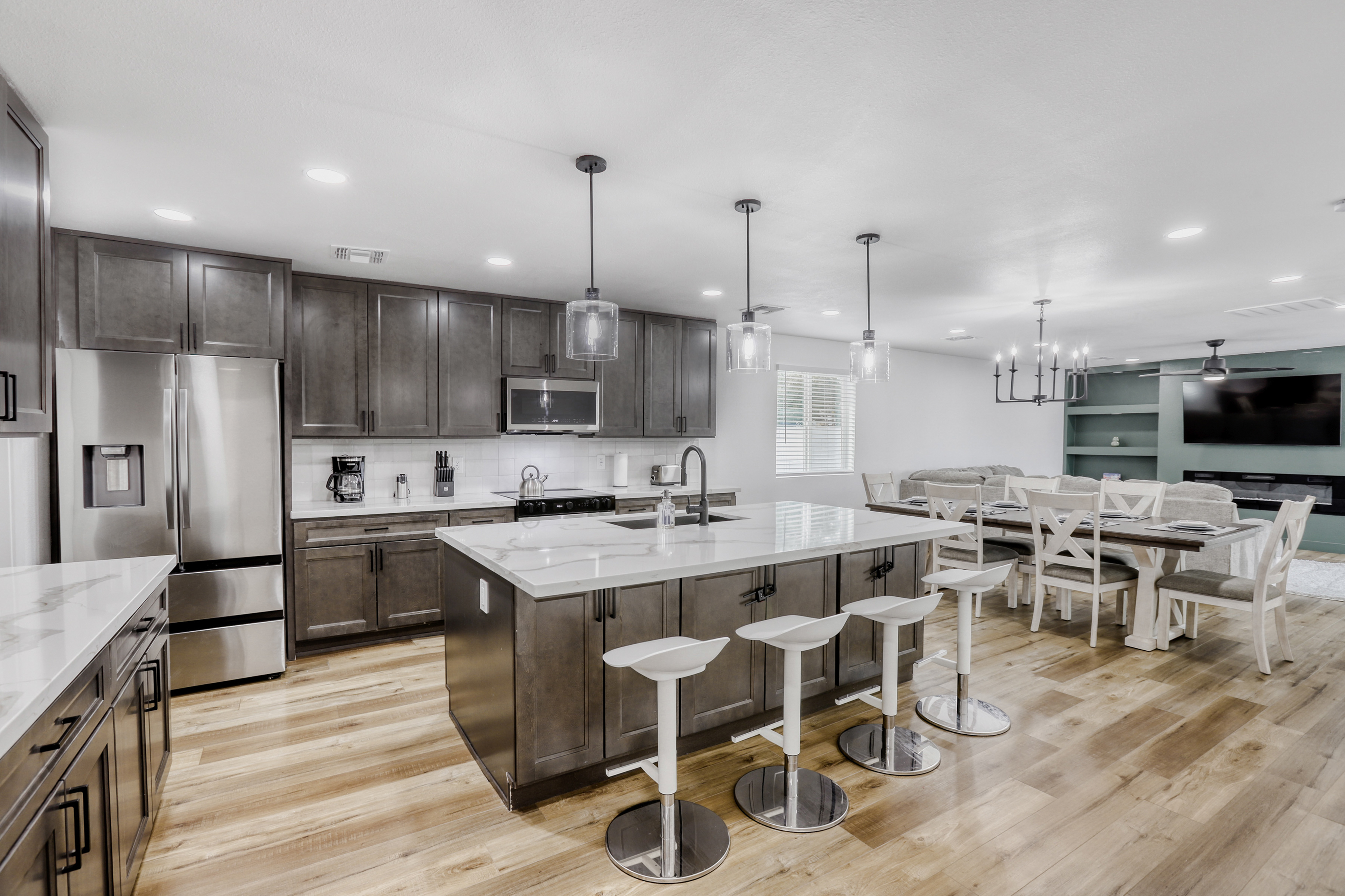 Spacious open kitchen with large island seating and stylish dining area