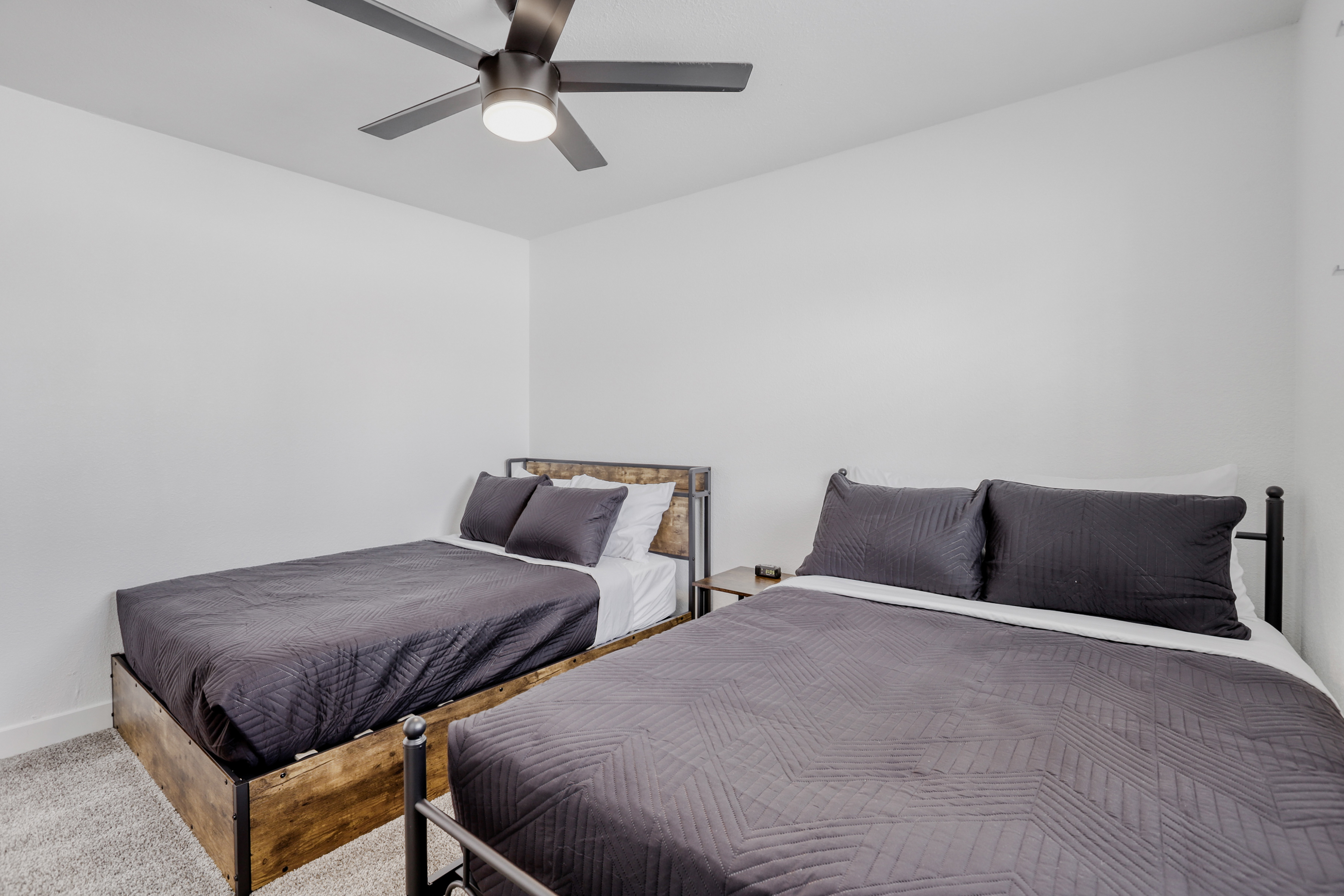 Bright bedroom with two comfortable beds and a clean, modern design