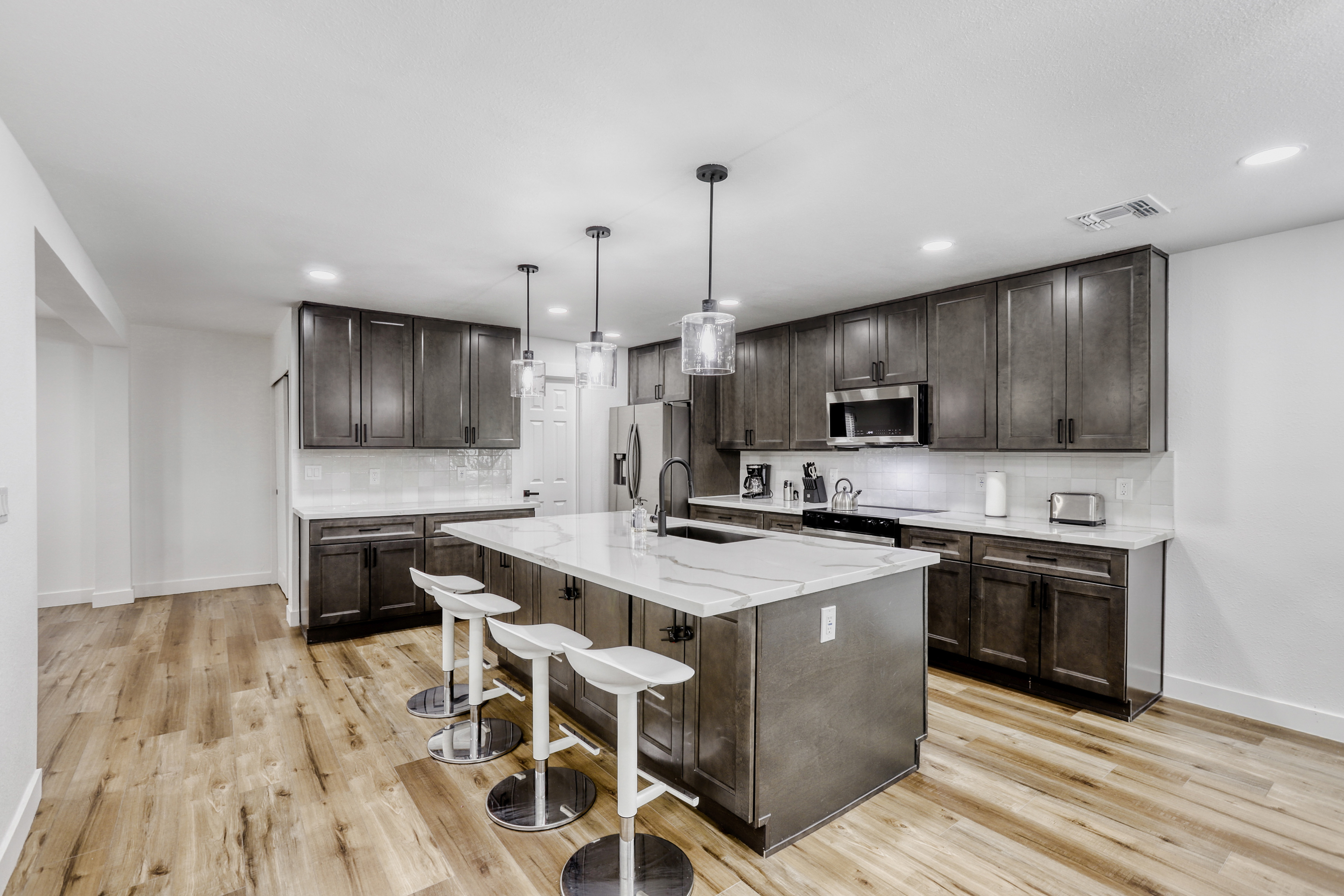 Spacious modern kitchen with island seating and sleek stainless appliances