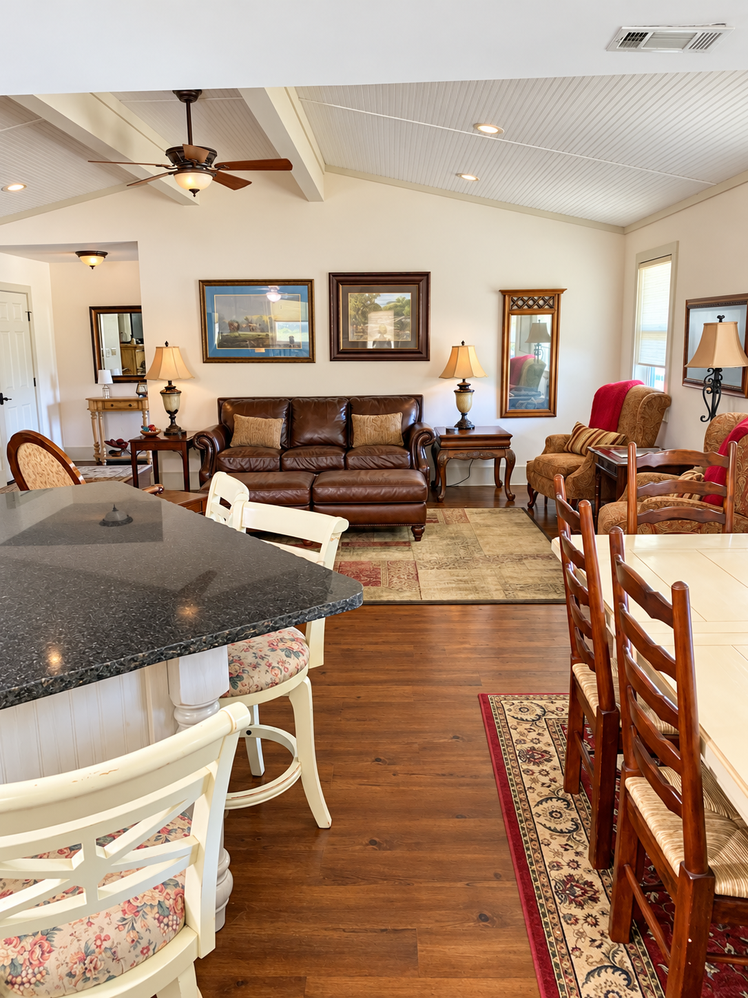 Bright open living area with vaulted ceilings and spacious dining