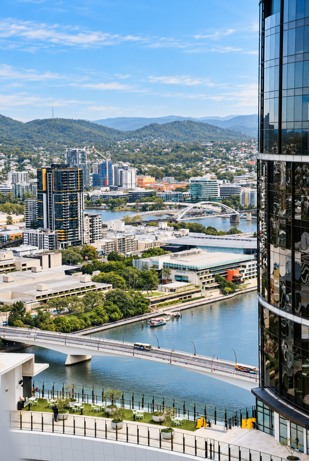 Stunning high-rise river views with city skyline and leafy mountain backdrop