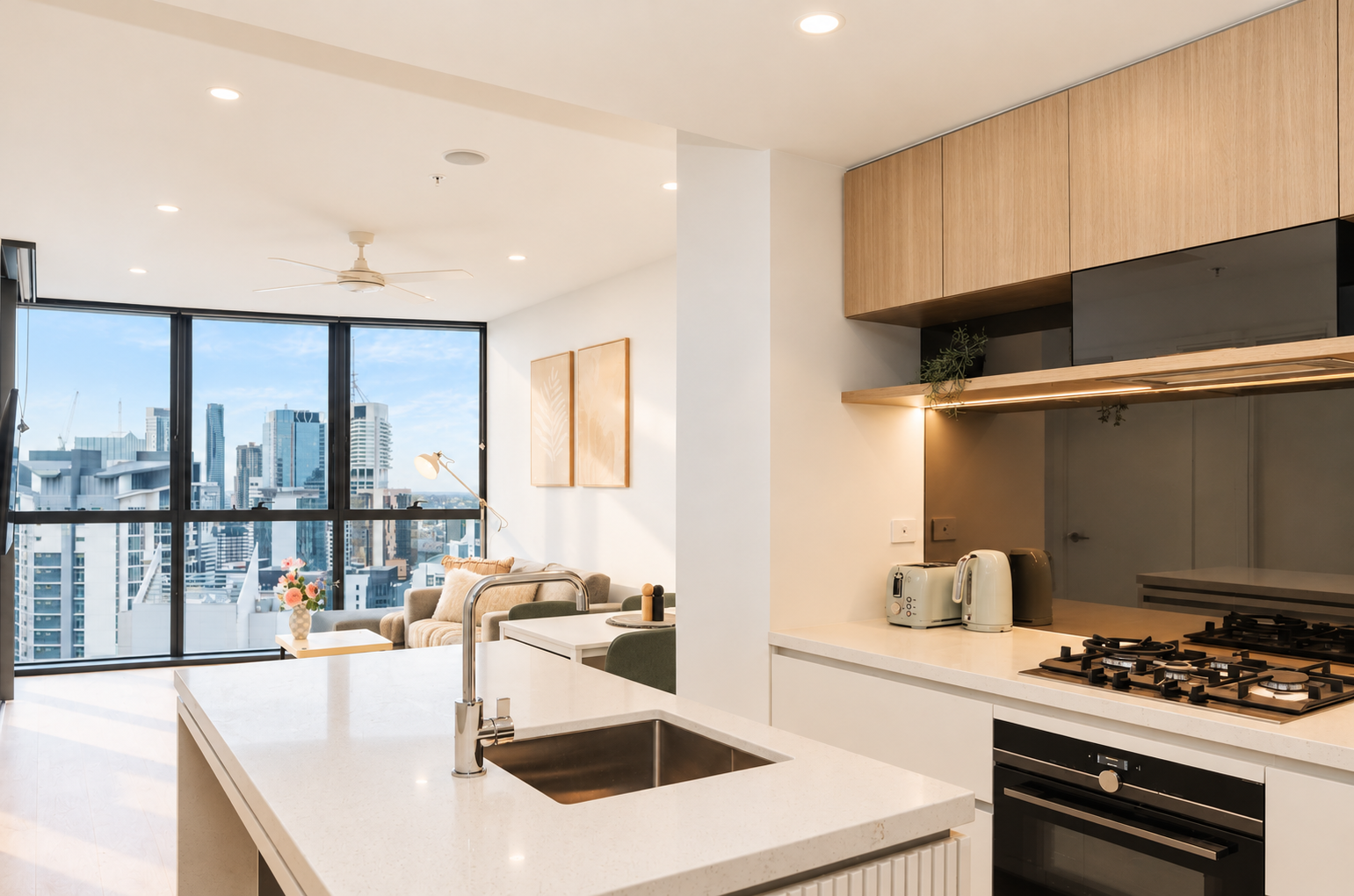 Bright modern kitchen with island and stunning city skyline views