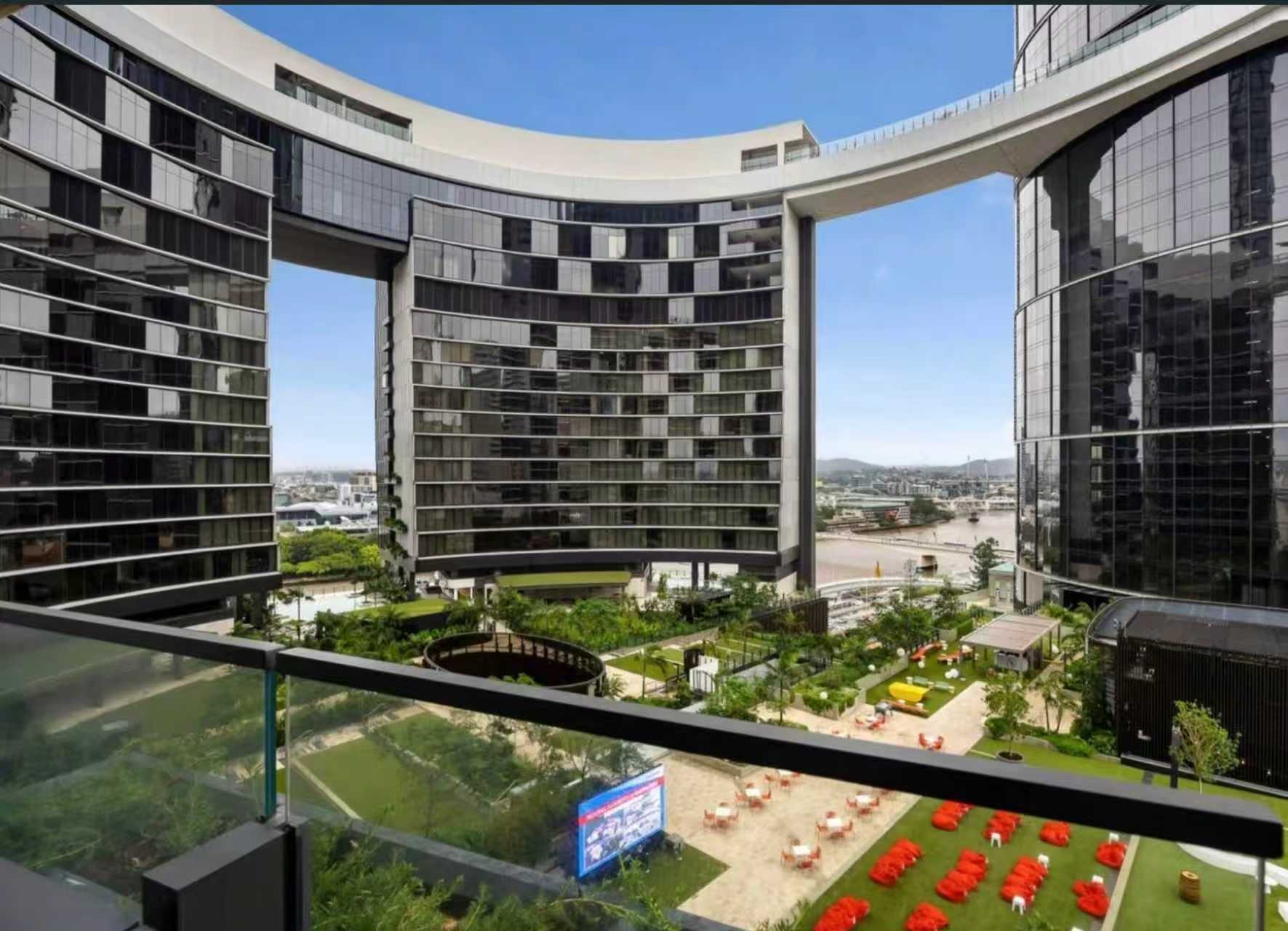 Private balcony overlooking a sleek courtyard in a luxury modern complex