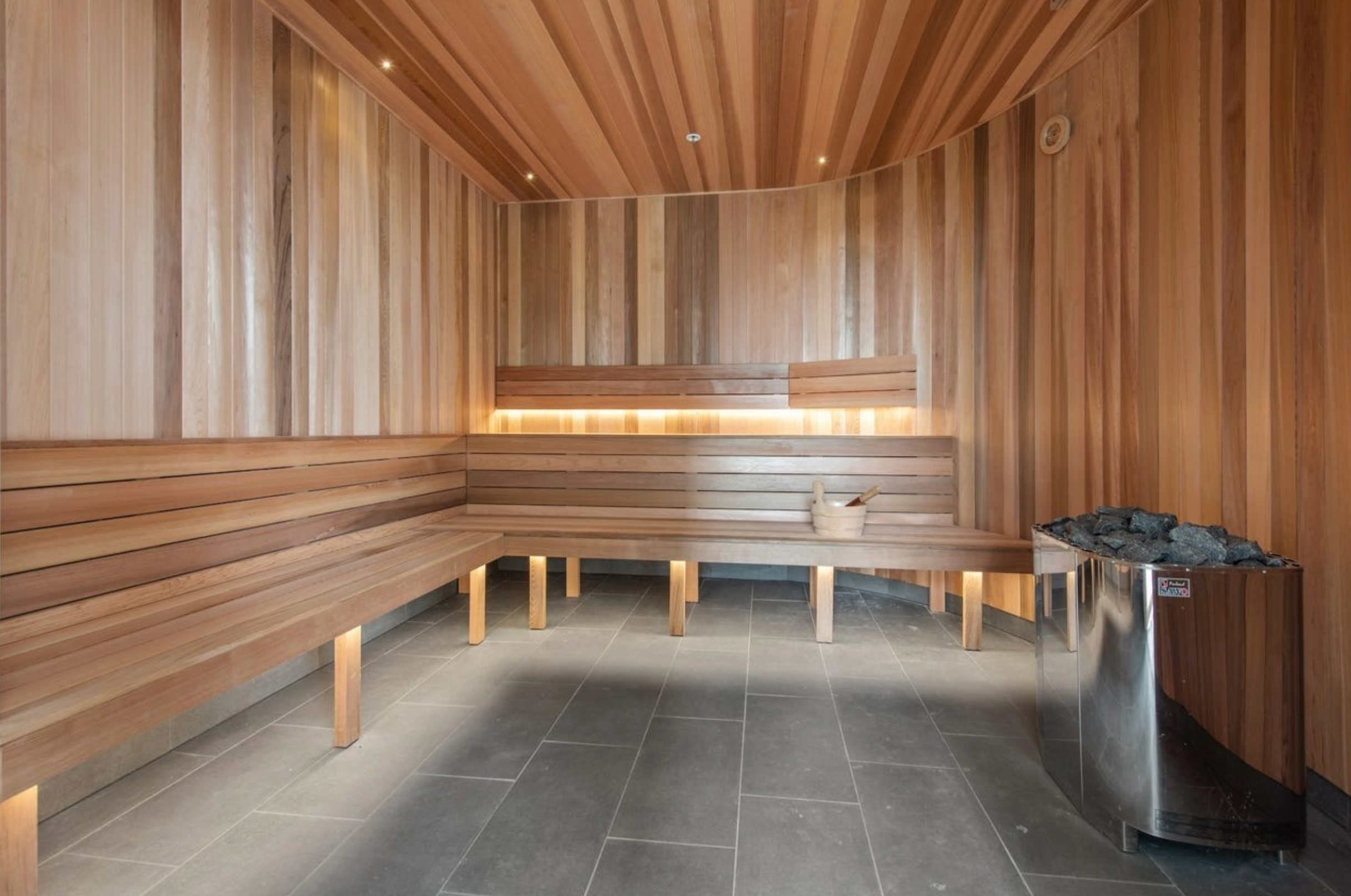 Relax in the sleek cedar sauna with spa-style lighting and ample seating