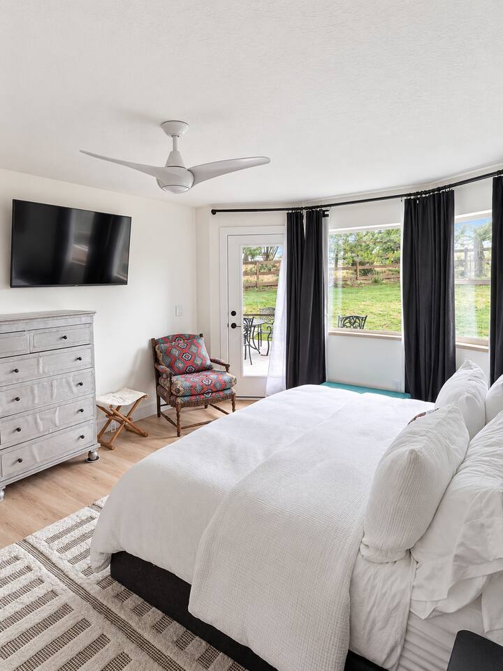 Primary Suite (Main Level) with King Bed and 55" Smart Roku TV