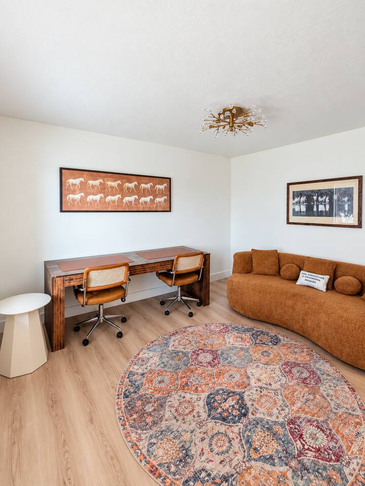Den (Main Floor) with 2 seat desk and sofa