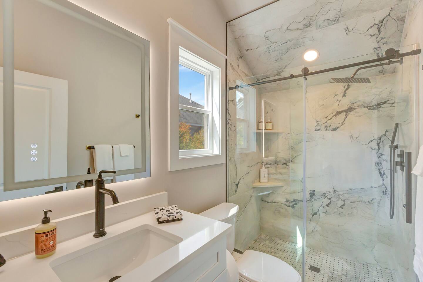 Beautiful brand new bathroom with rain shower.