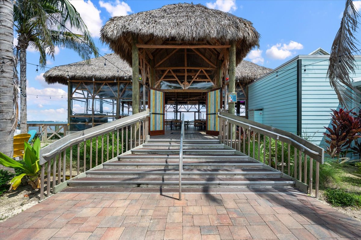 Tropical waterfront pavilion with thatched roof and easy ramp access