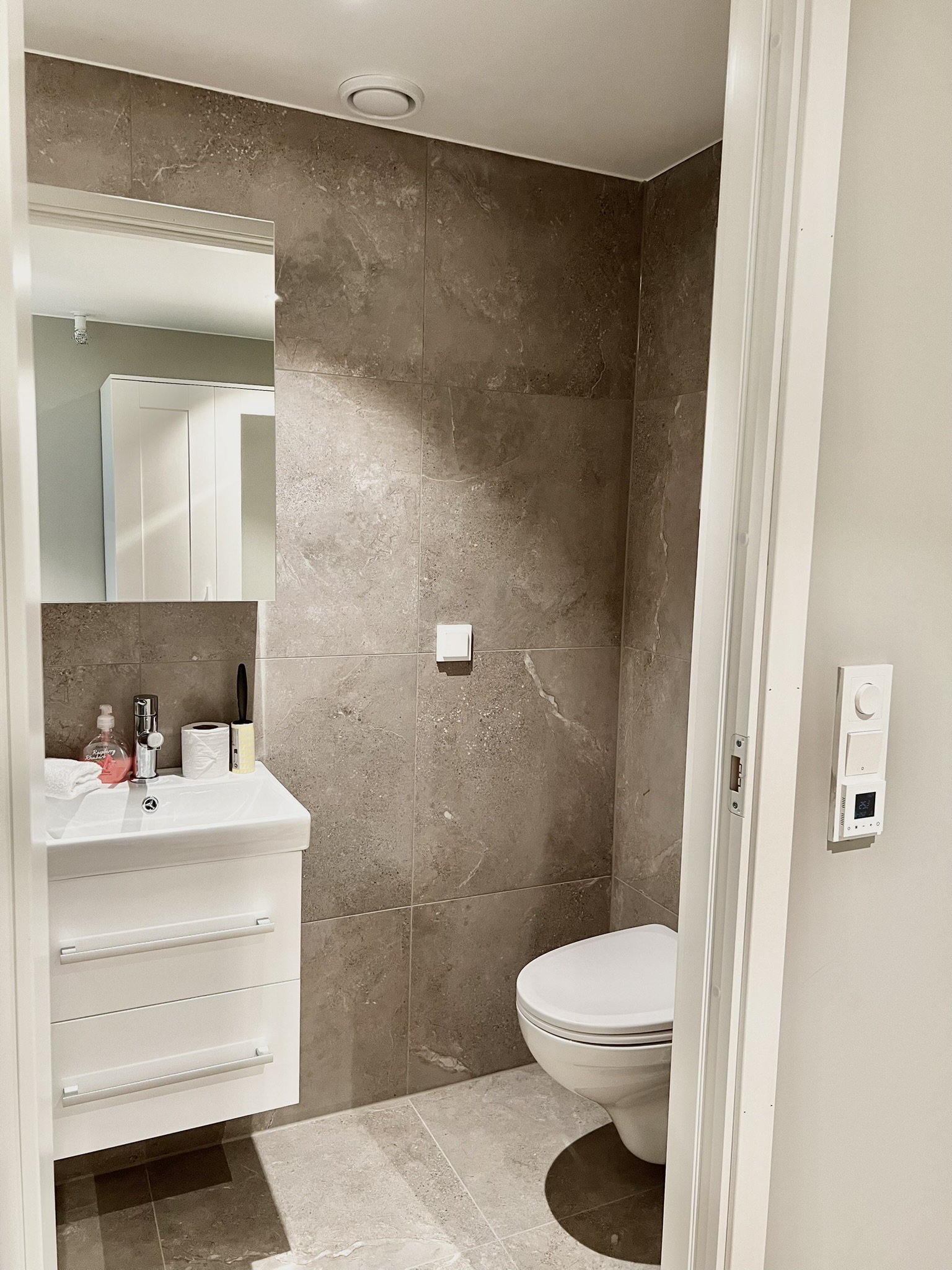 Private Modern tiled bathroom with sleek vanity and clean minimalist design