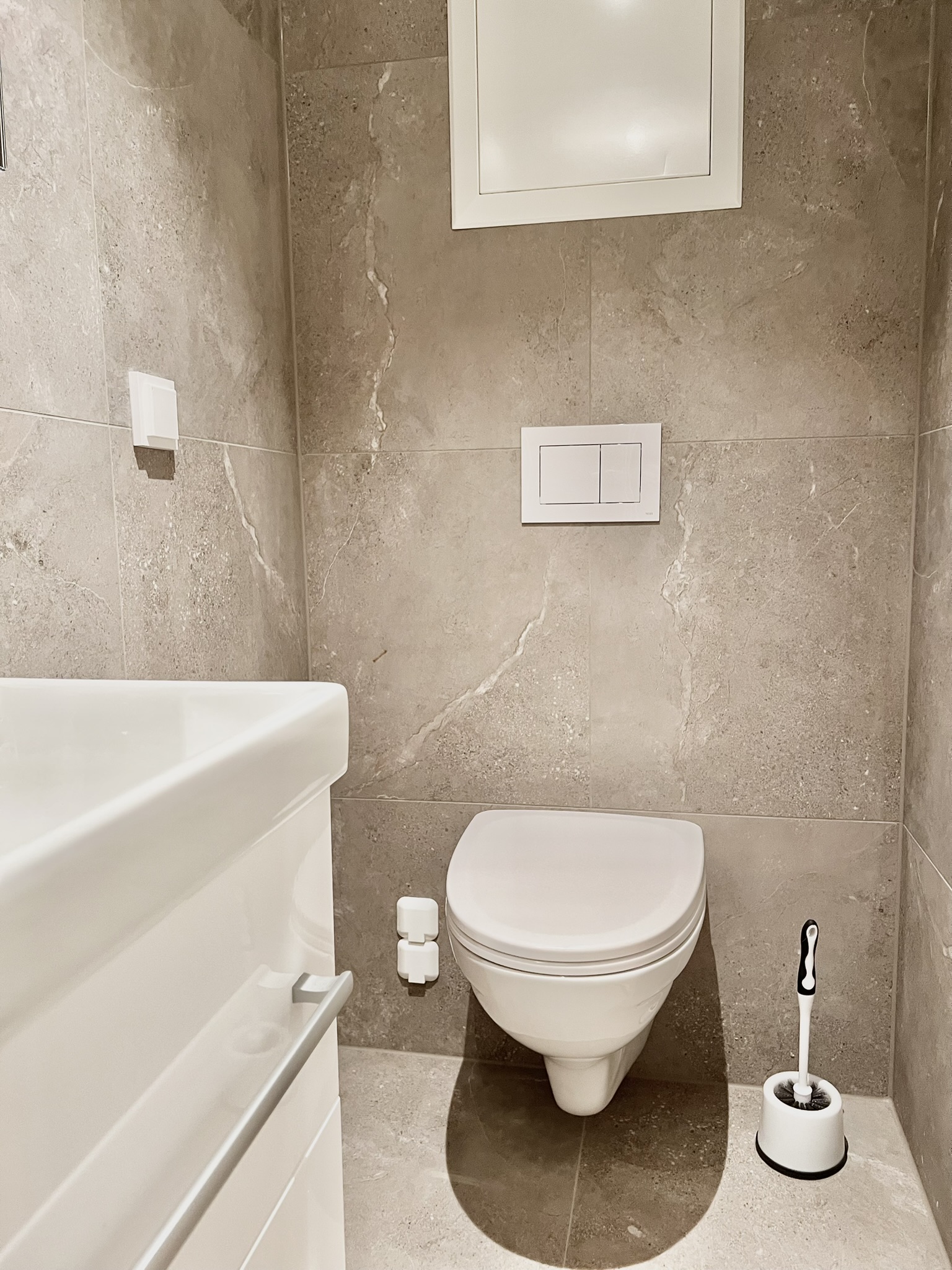 Modern tiled bathroom with sleek finishes and a clean, minimalist design
