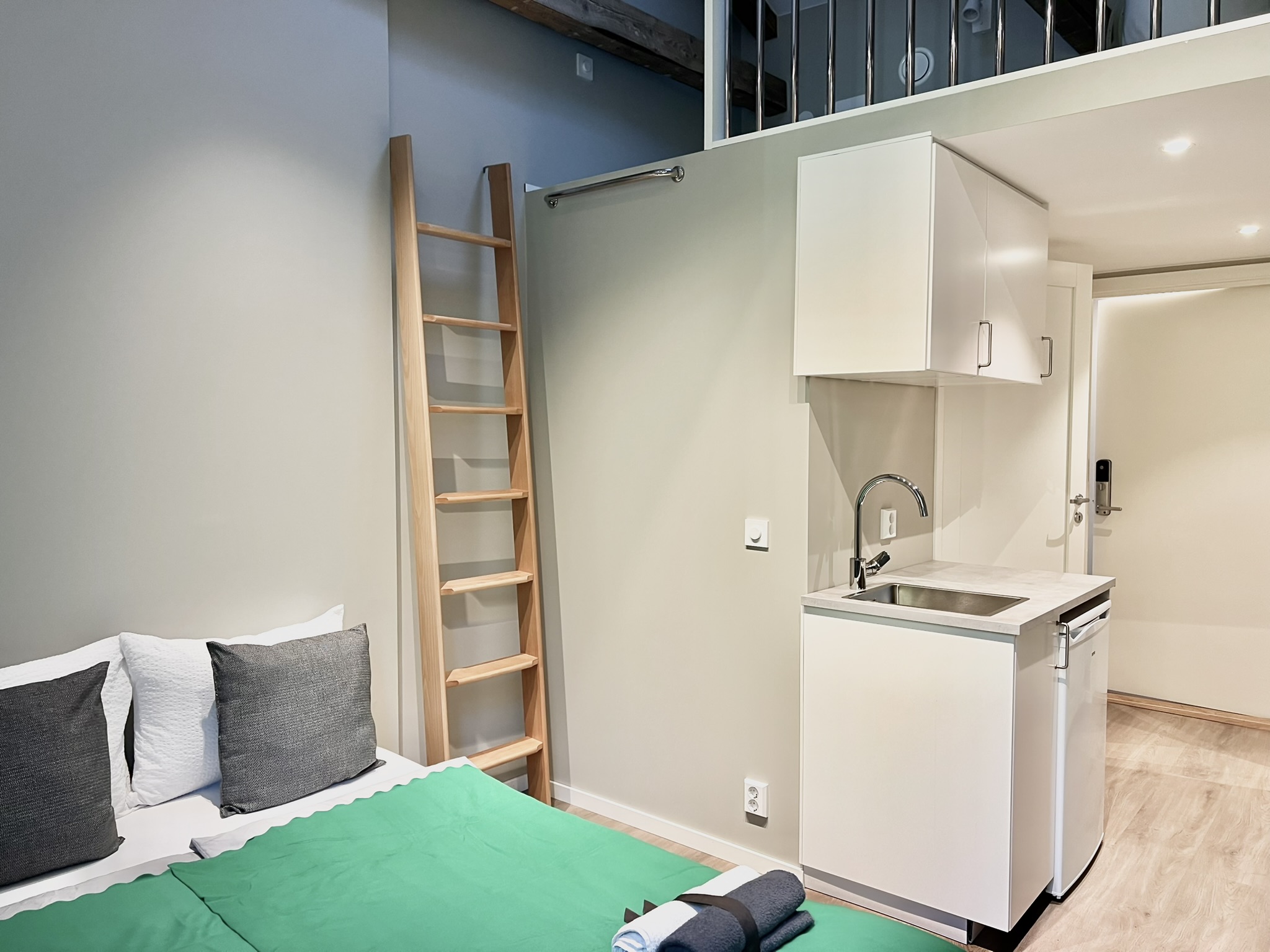 Modern studio with kitchenette and cozy loft-style charm