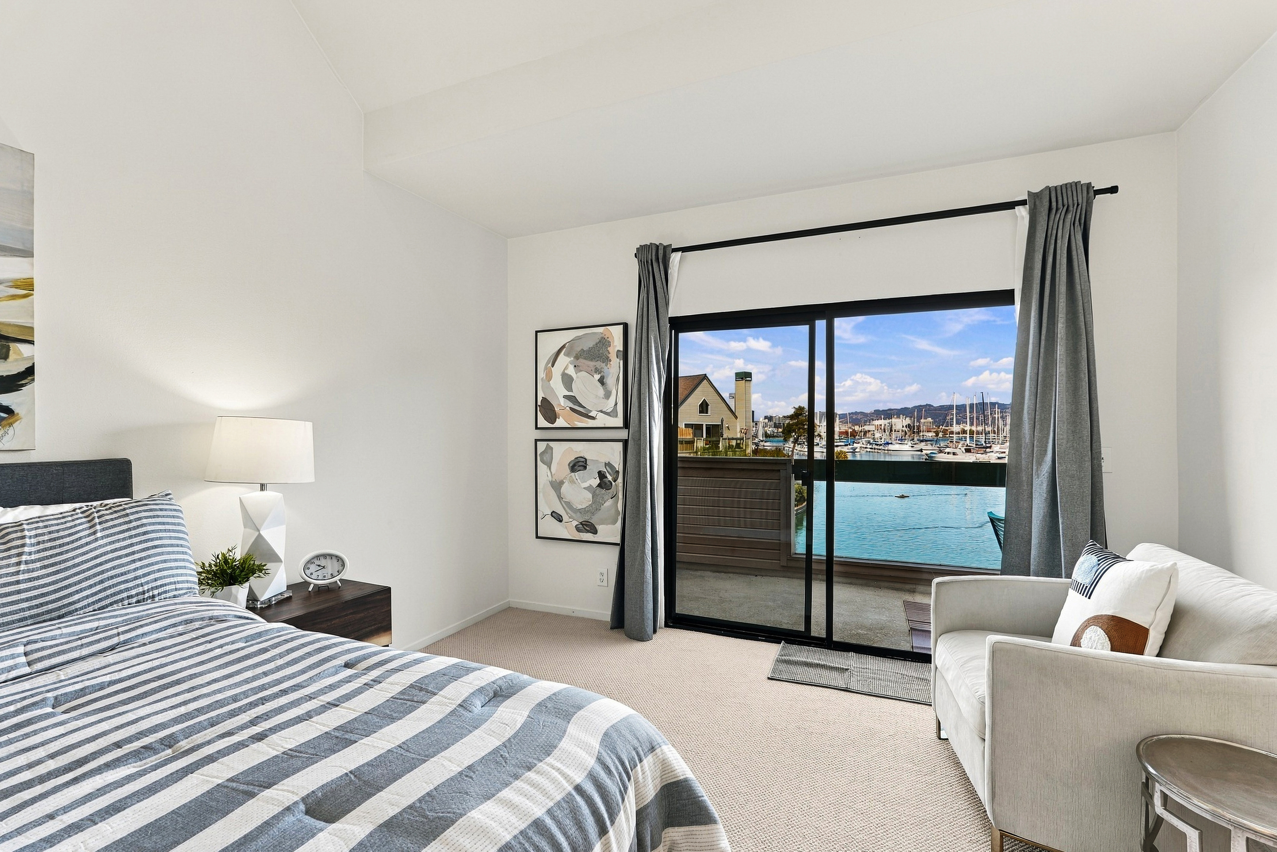 Bright bedroom with private balcony and stunning marina views