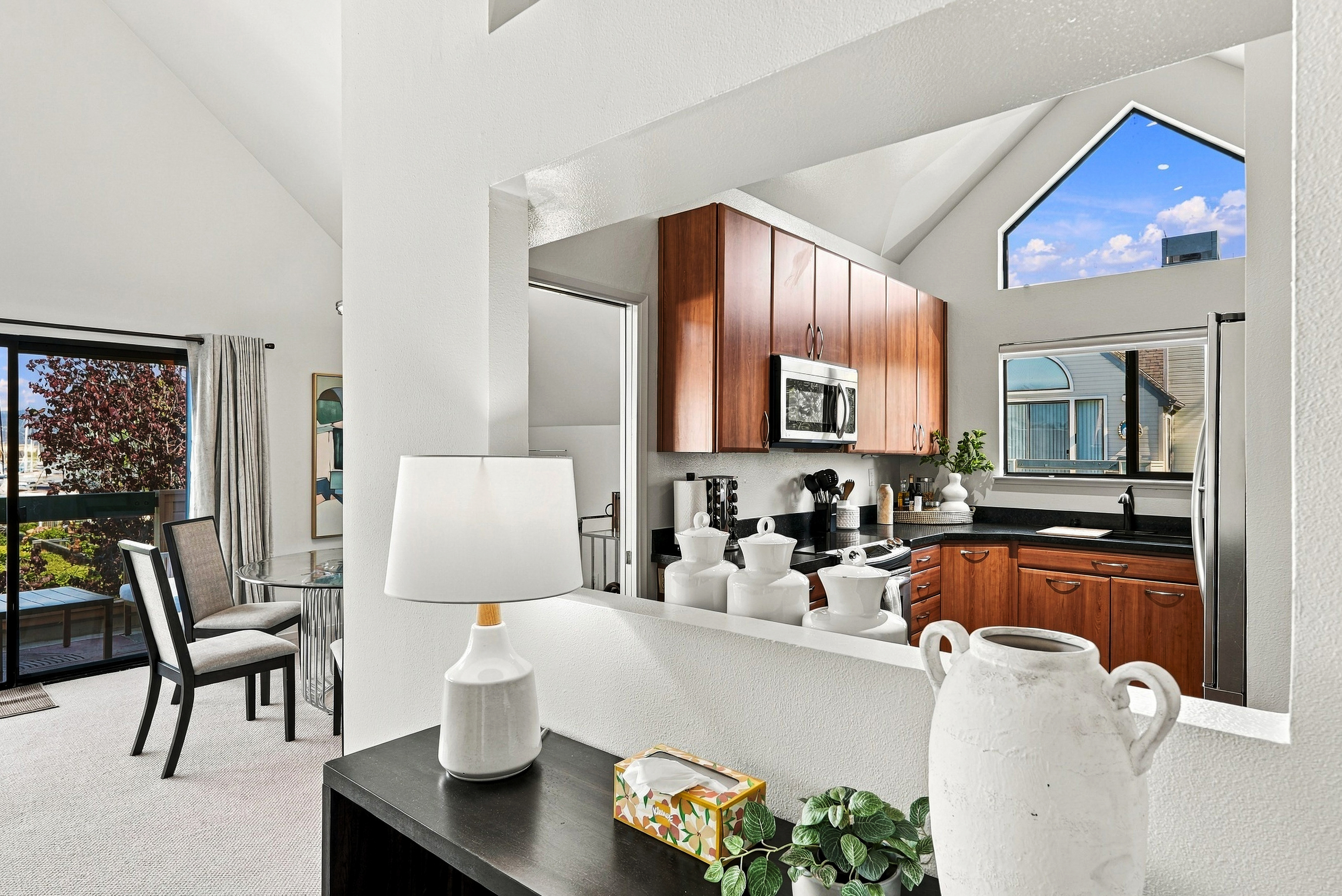 Bright vaulted kitchen with dining nook and stylish natural light