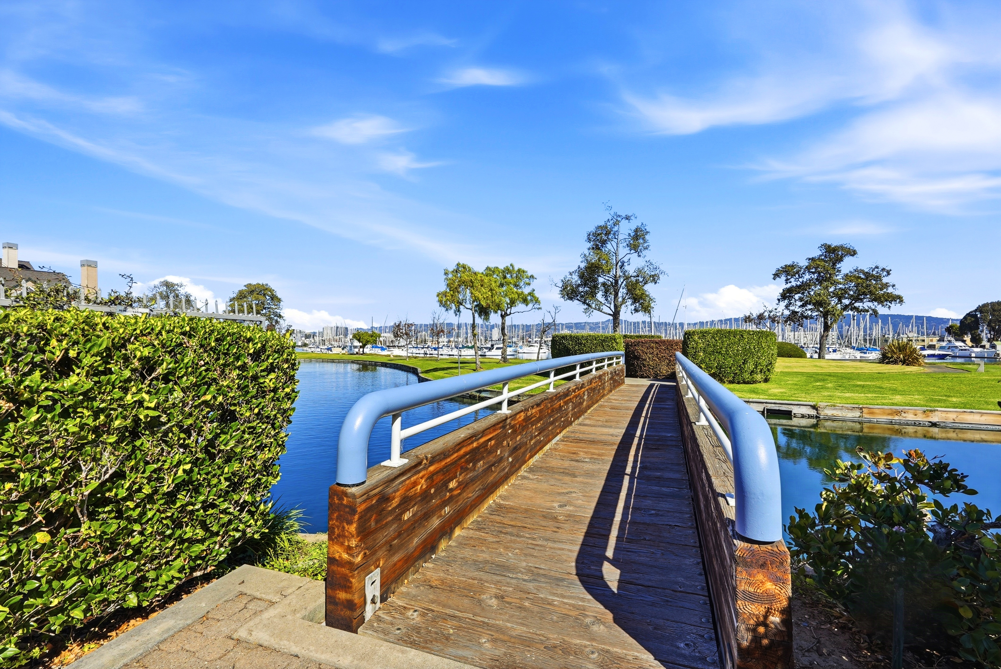 Scenic footbridge leading to marina views and peaceful waterfront grounds