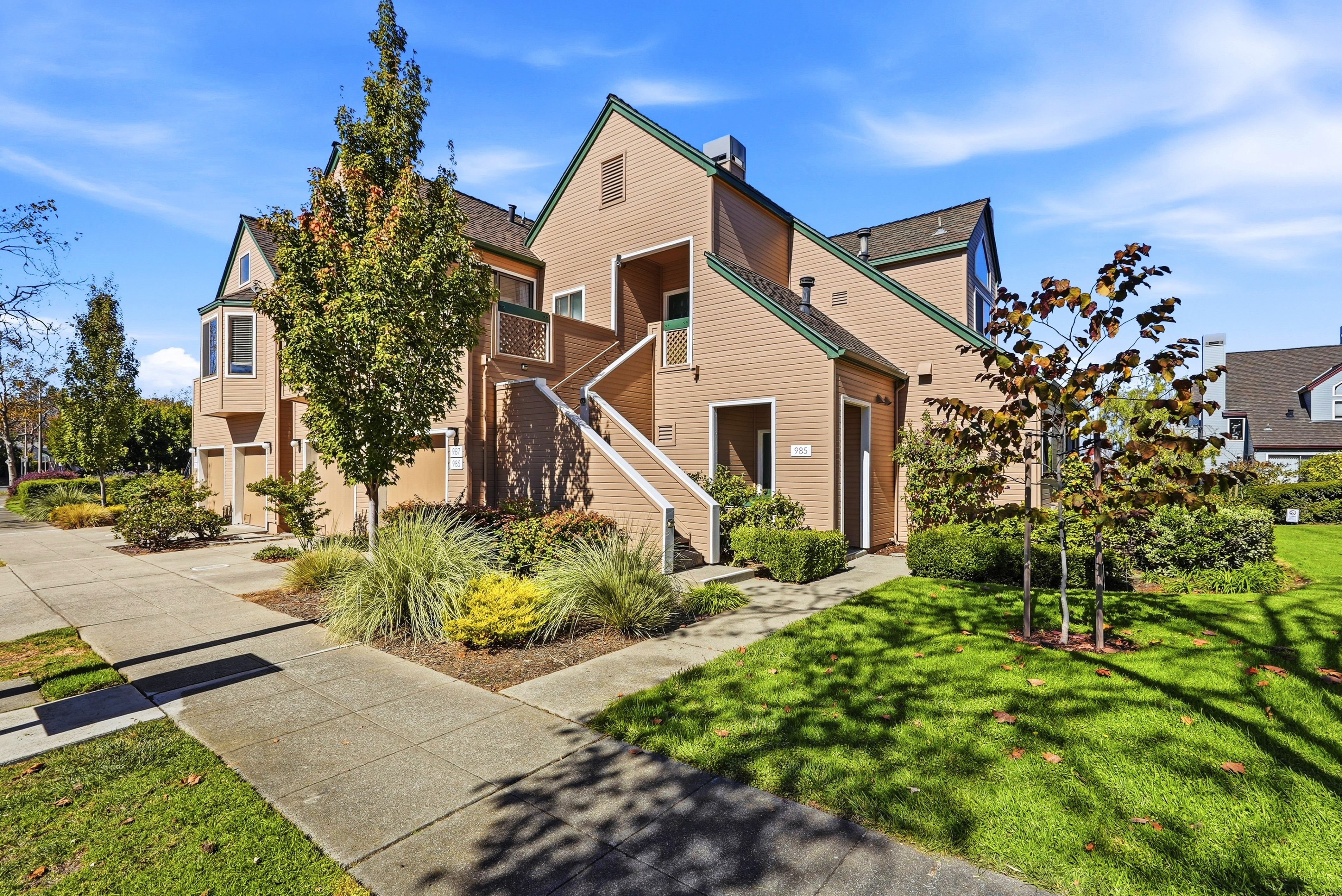 Inviting exterior with lush landscaping and bright curb appeal