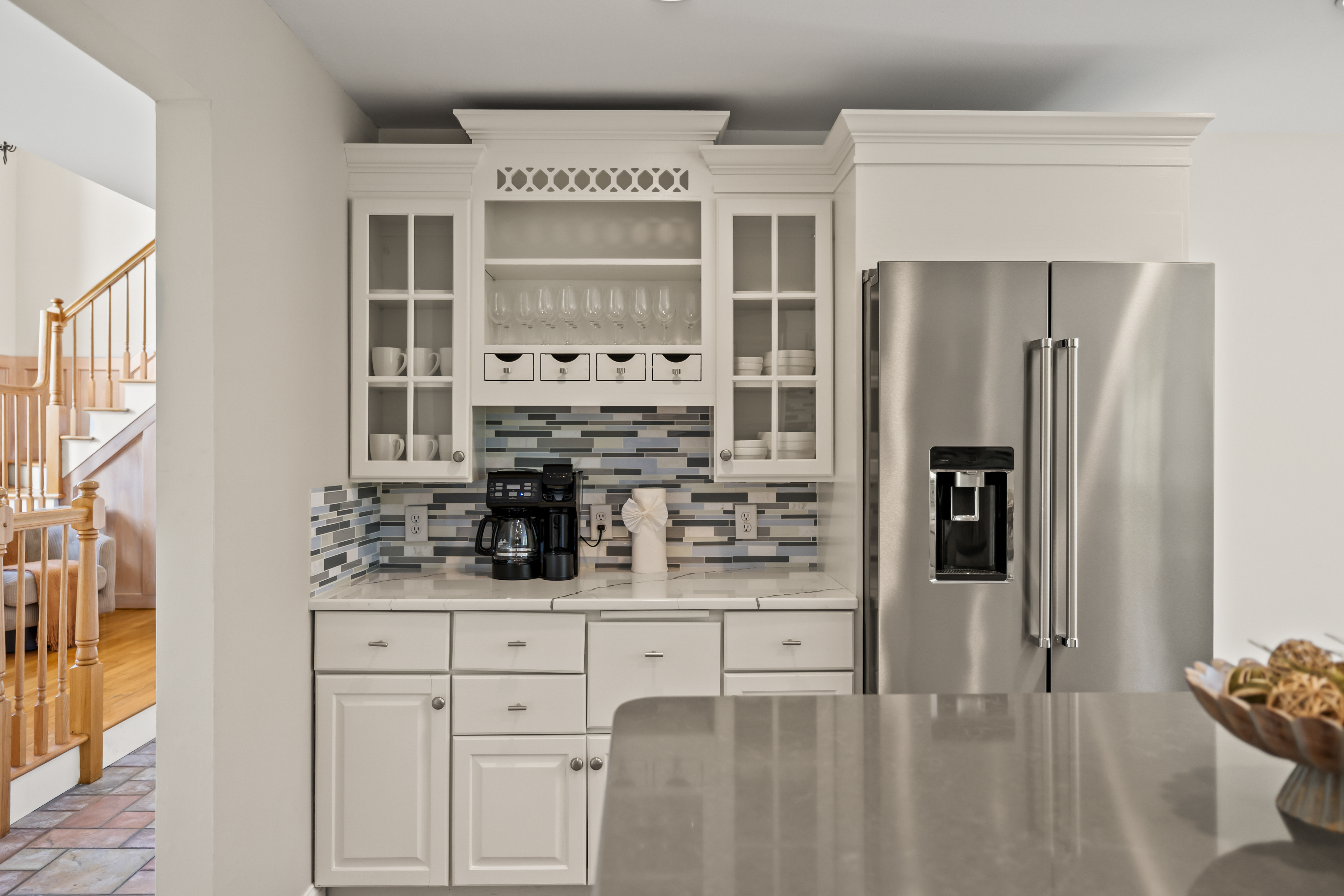 Bright modern kitchen with coffee station and stainless steel appliances