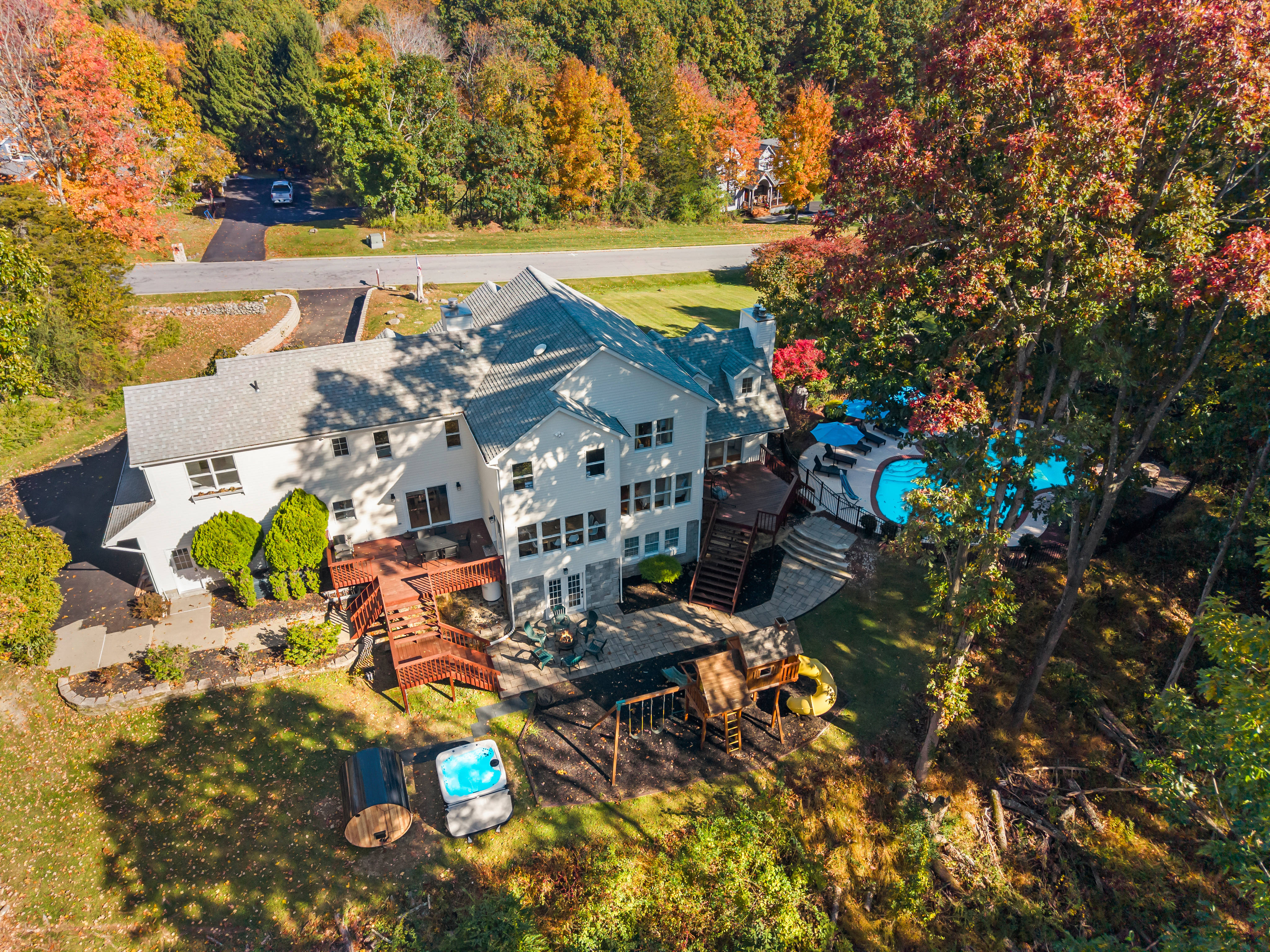 Private wooded retreat with pool, hot tub, deck & spacious backyard