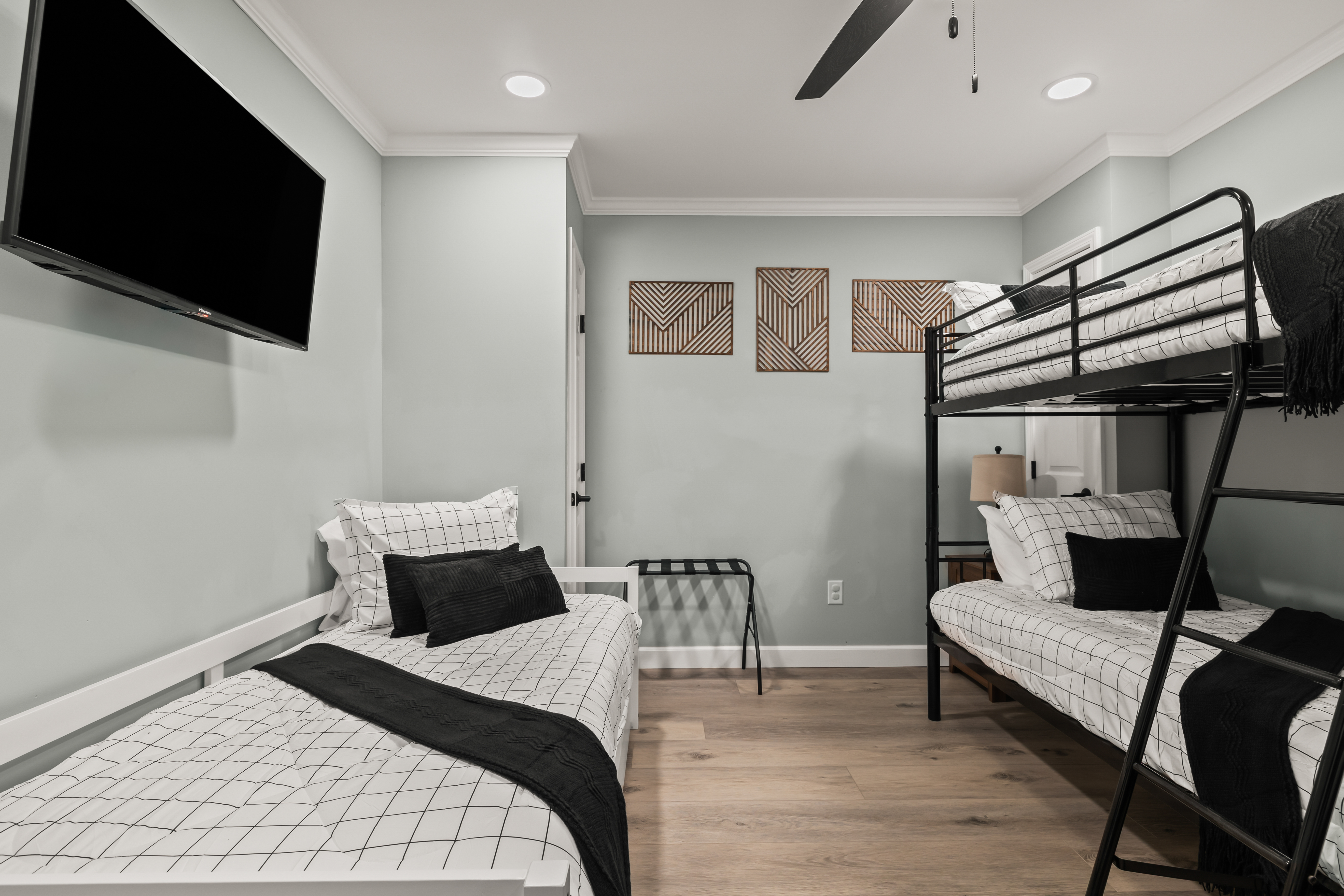 Modern bunk room with TV—perfect for kids, friends, or group stays