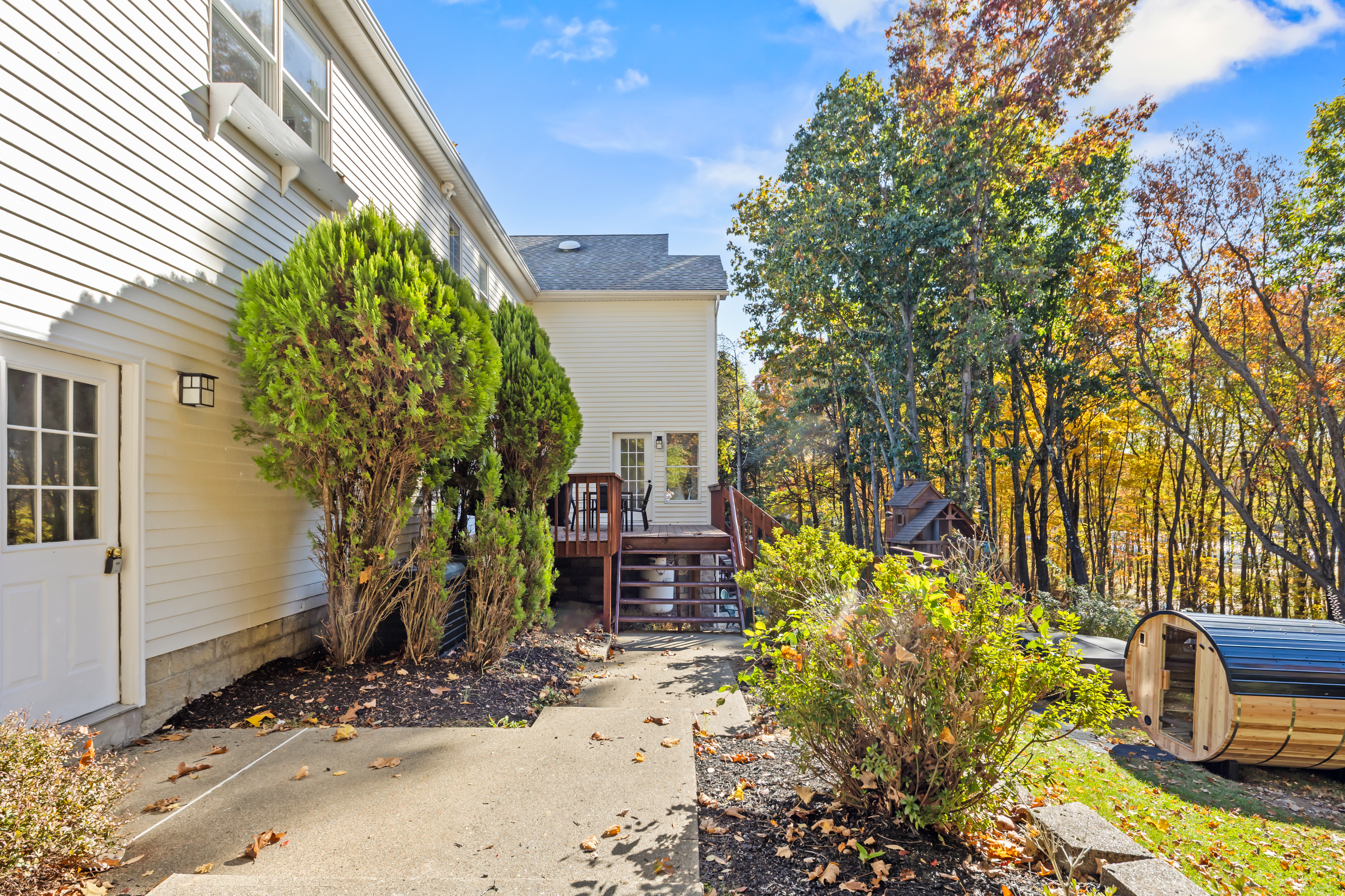 Private wooded backyard with deck access and a relaxing outdoor sauna