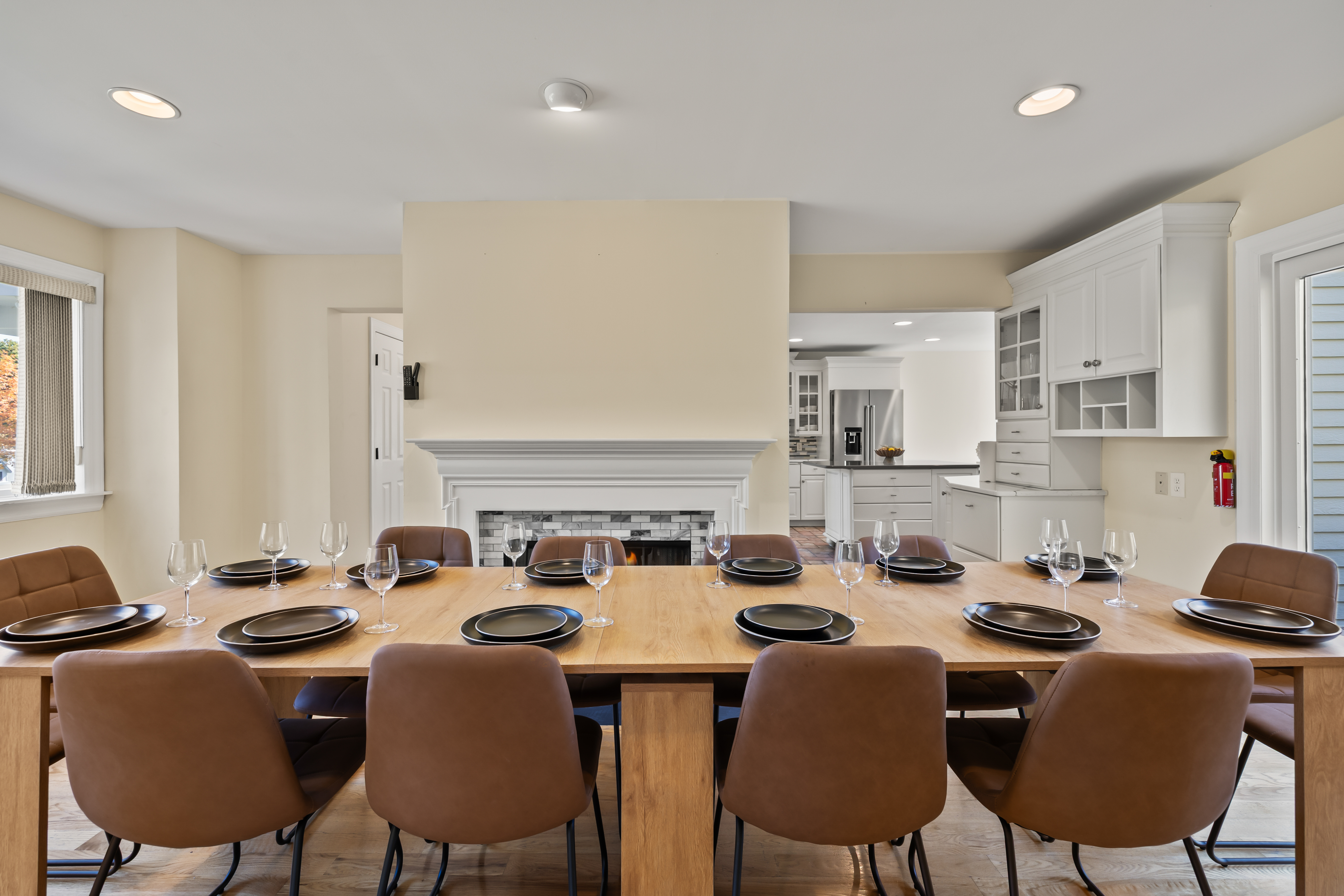 Spacious dining for 10 with cozy fireplace and open kitchen access