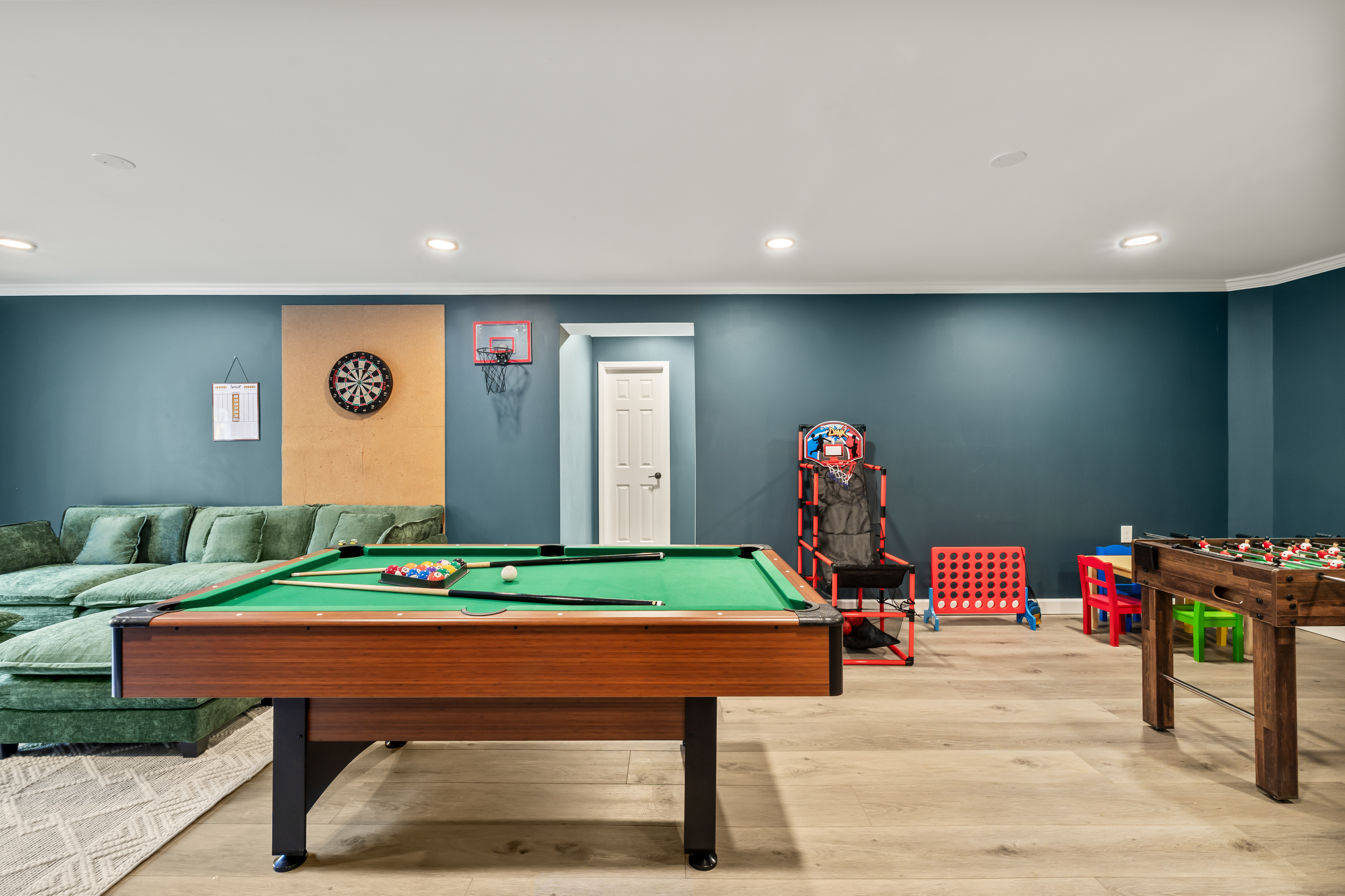 Spacious game room with pool, foosball, darts & family-friendly fun