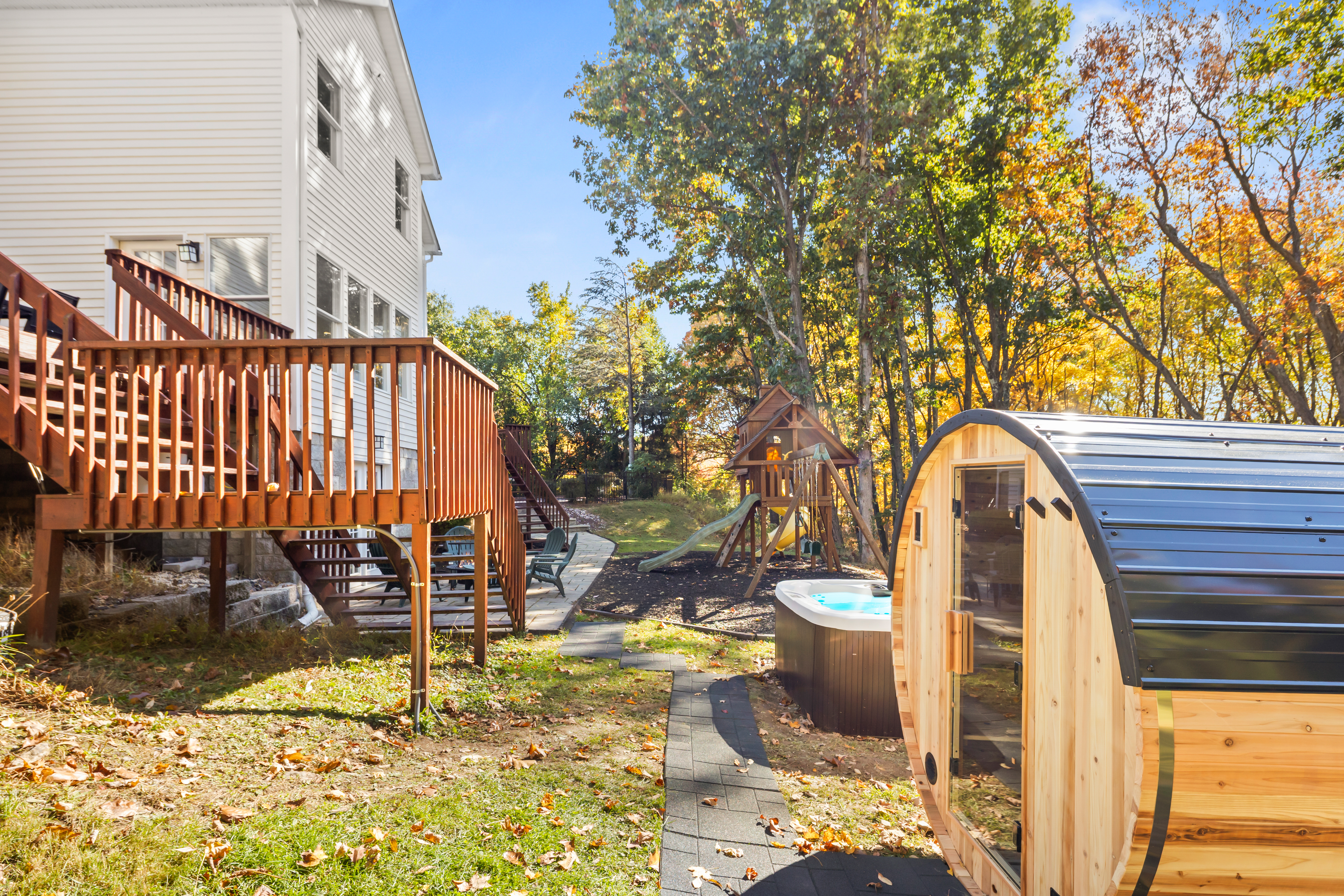 Private backyard with hot tub, barrel sauna, deck & wooded views