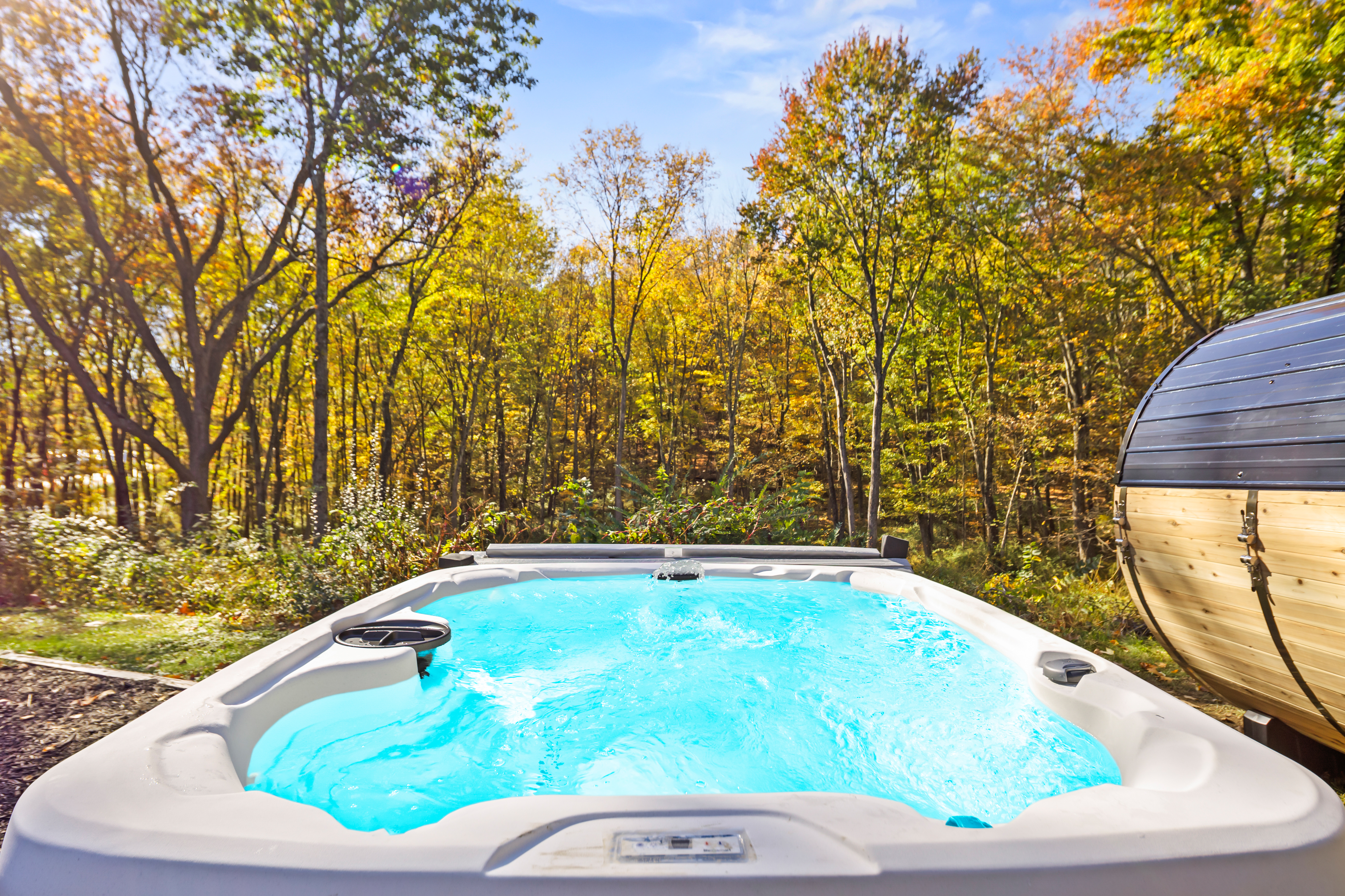 Private hot tub with serene forest views and stunning fall colors