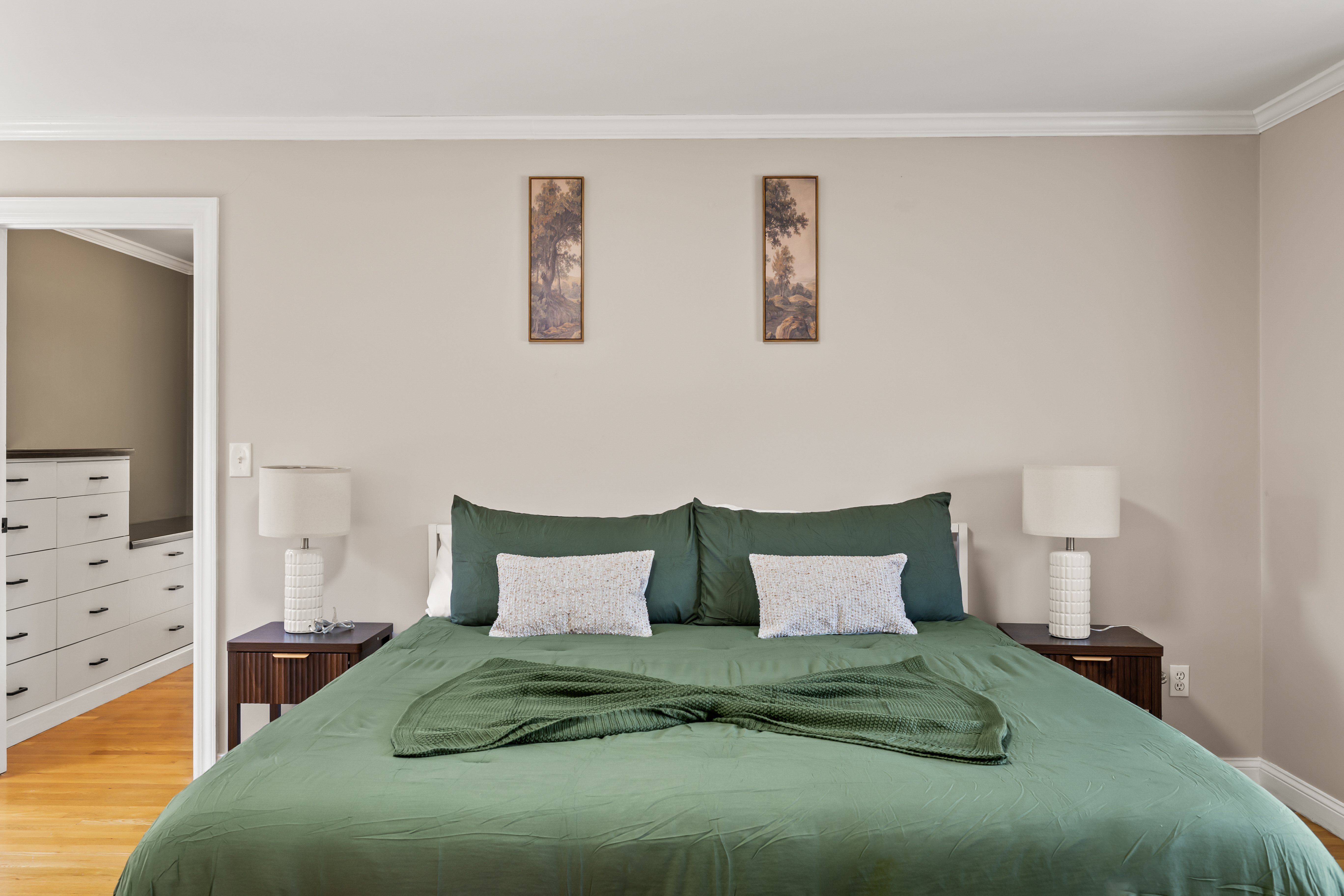 Spacious, serene bedroom with king bed and stylish symmetrical design