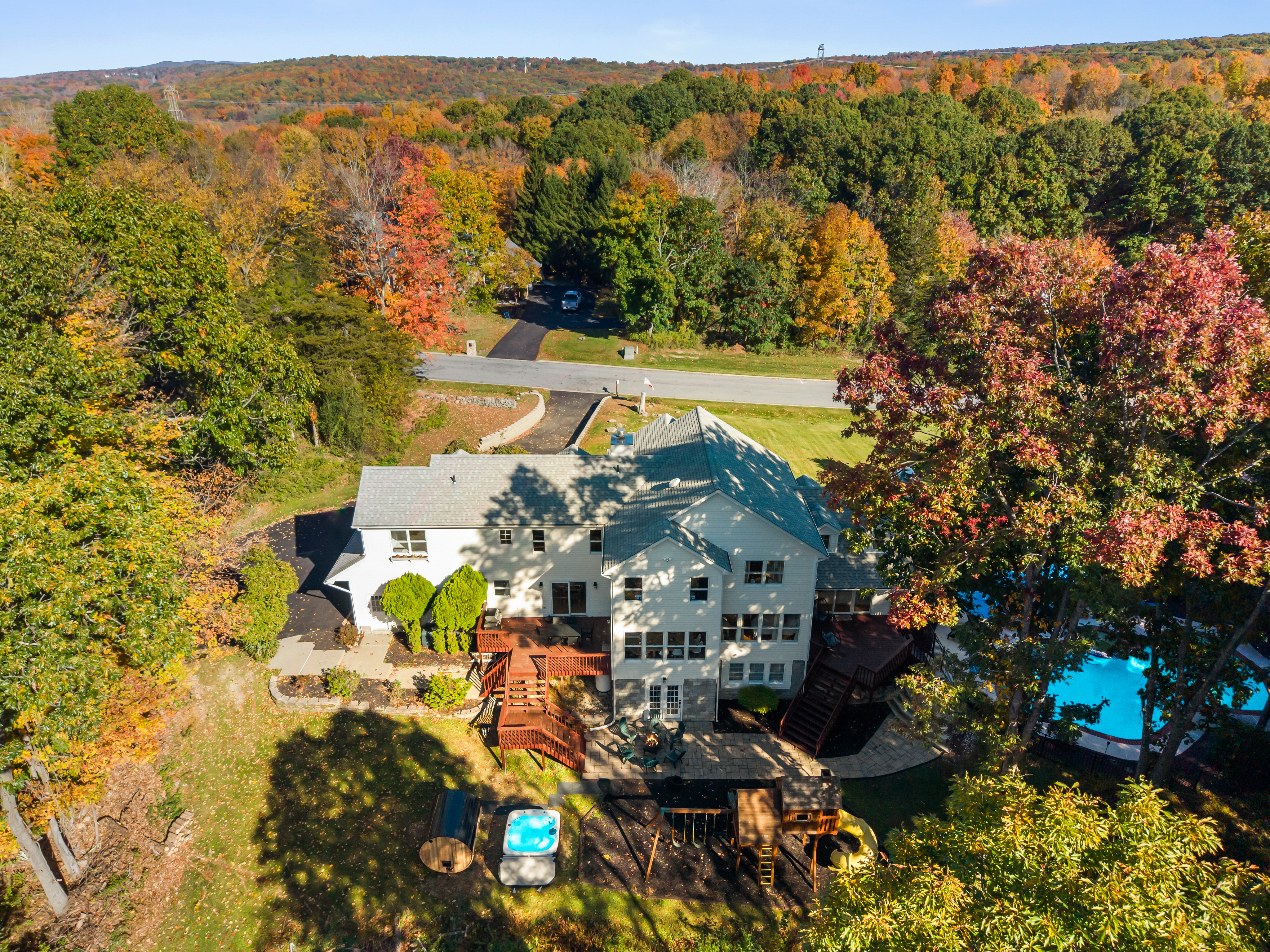 Spacious retreat with fall views, pool, hot tub, and expansive outdoor decks