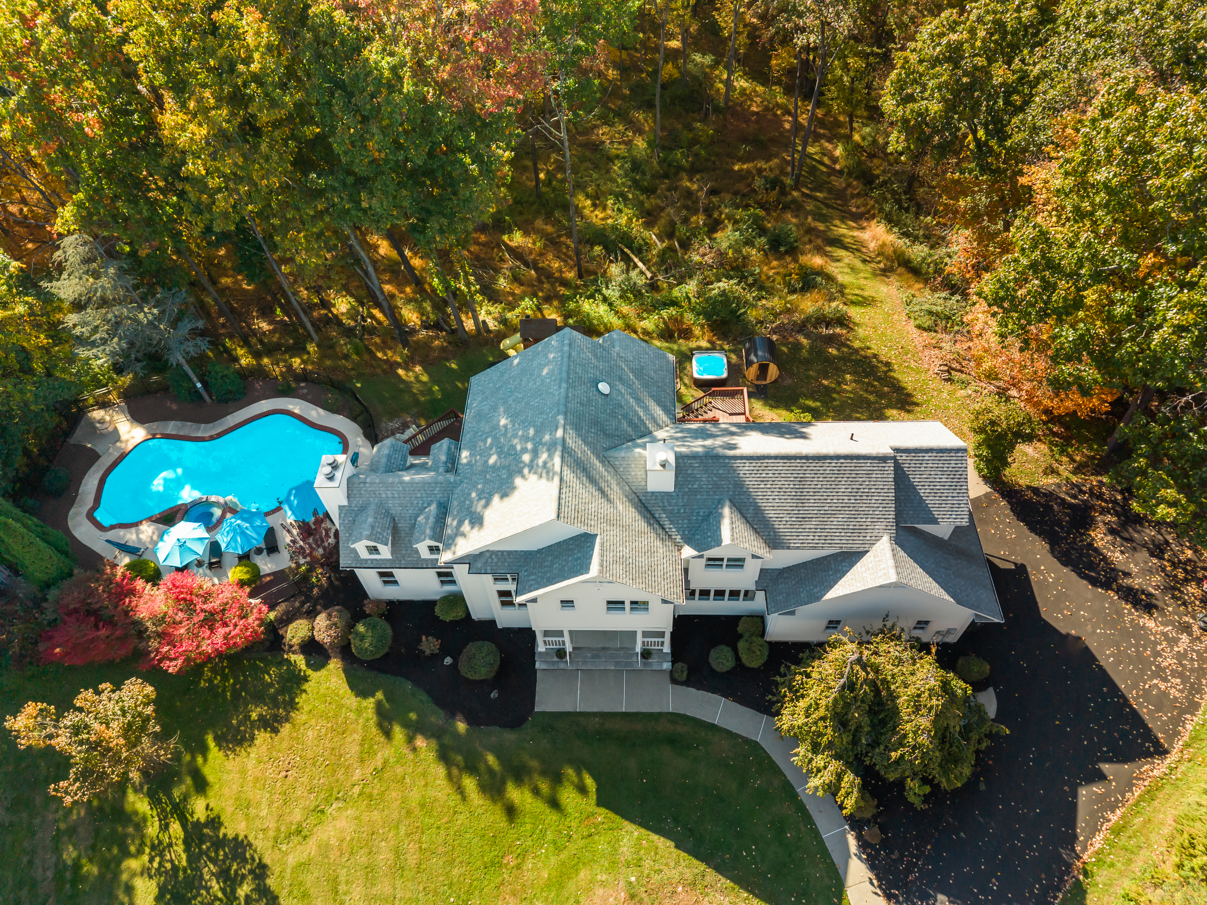 Private wooded estate with pool, hot tub, and expansive outdoor space