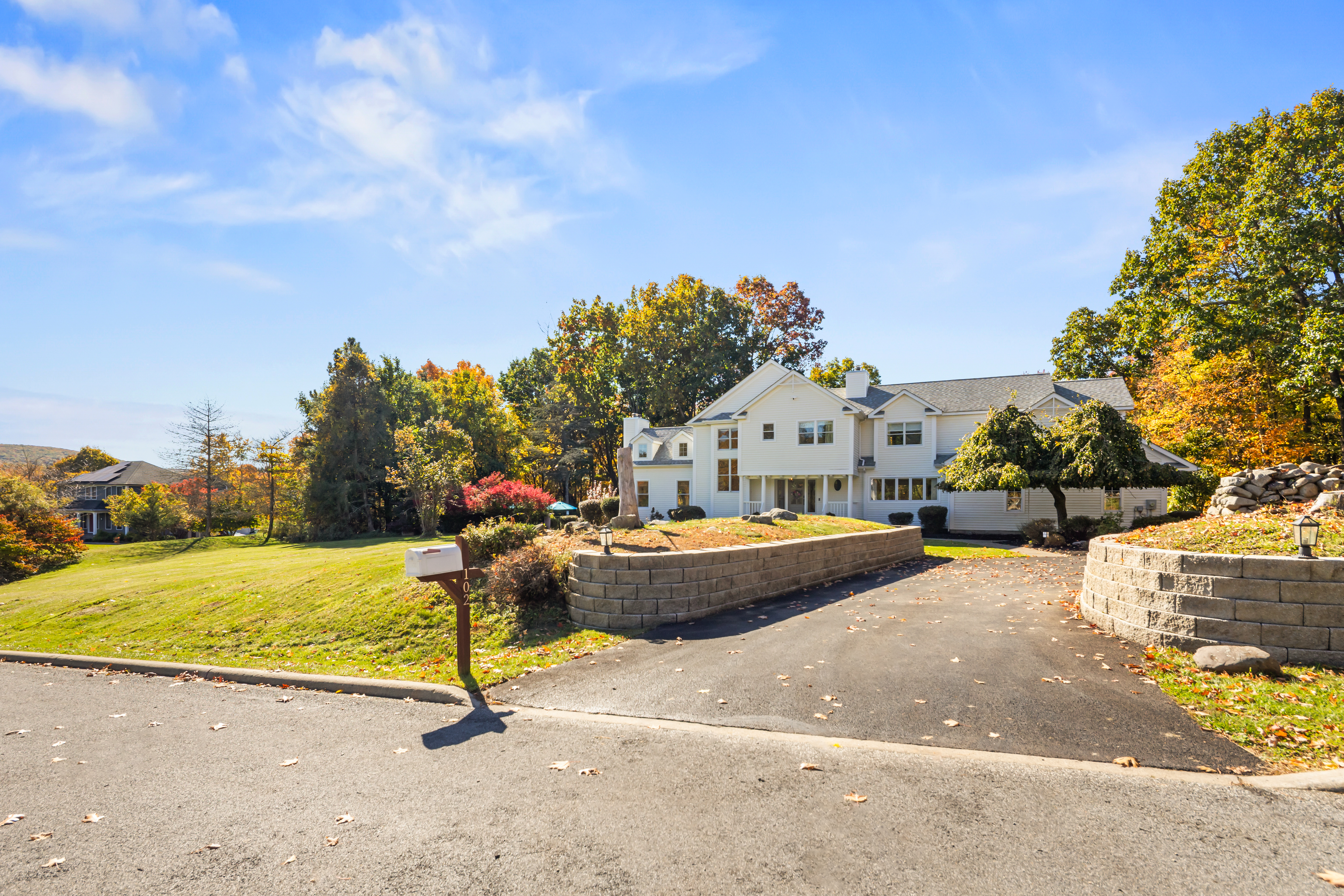 Spacious home with a large yard, private drive, and beautiful seasonal views