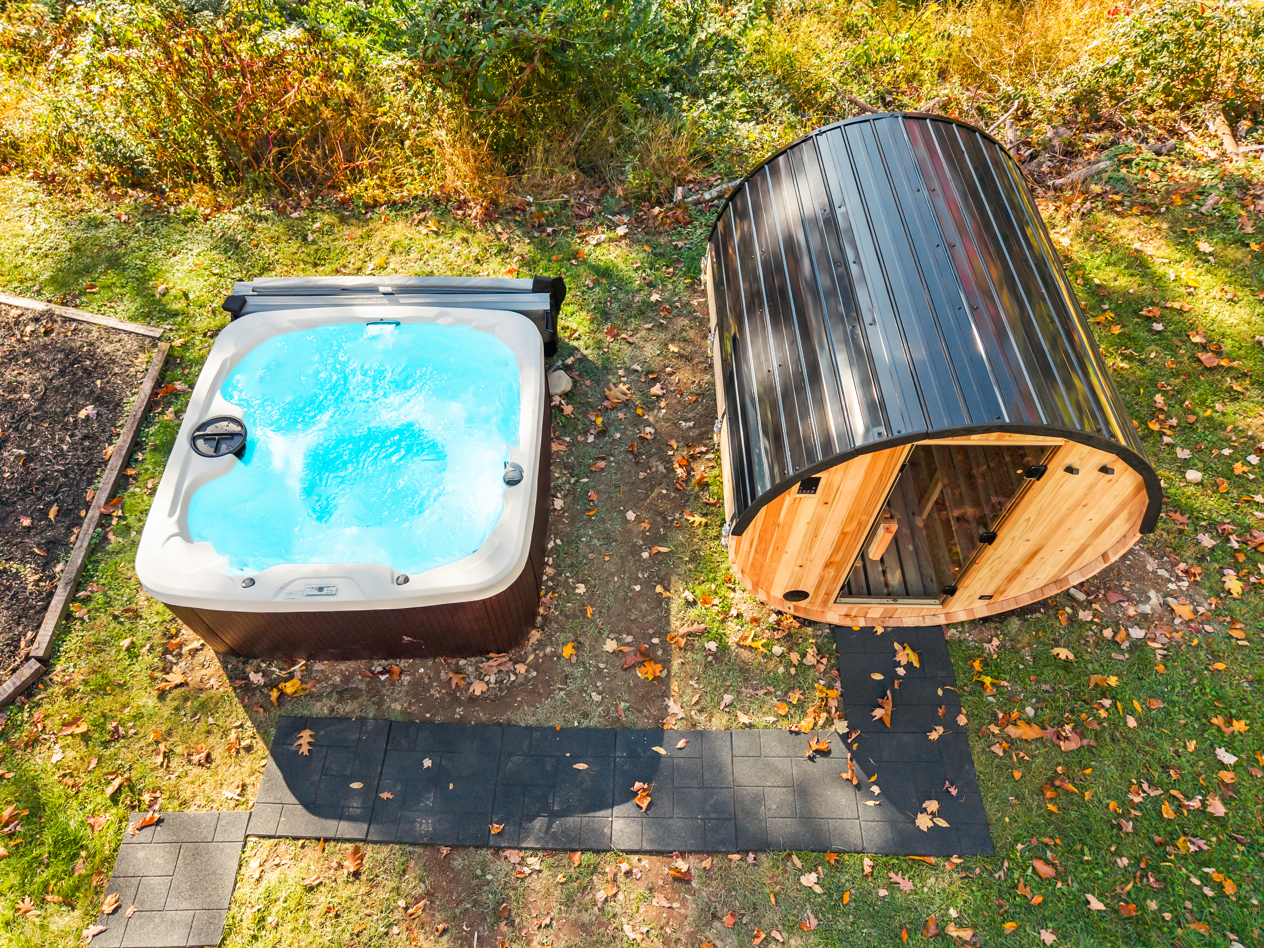Private hot tub and barrel sauna for a cozy outdoor spa retreat
