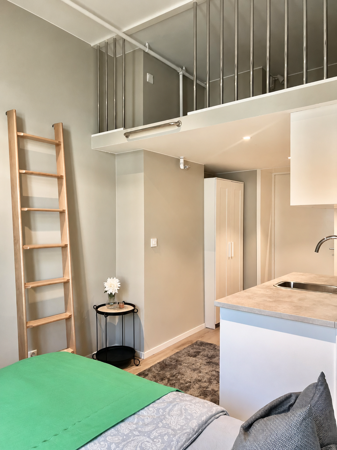 Modern loft studio with kitchenette and stylish, space-saving design