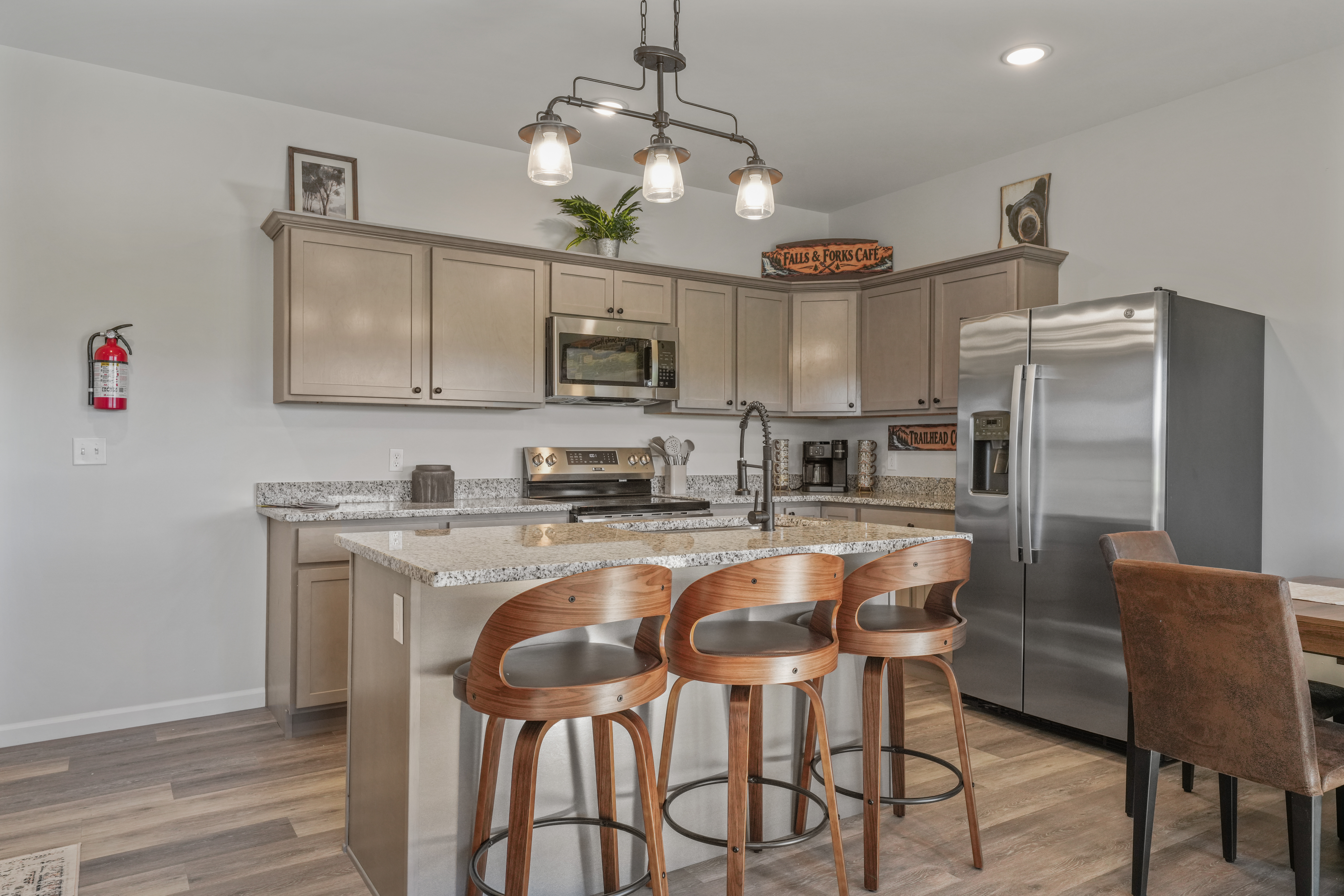 Bright modern kitchen with granite island and stylish bar seating