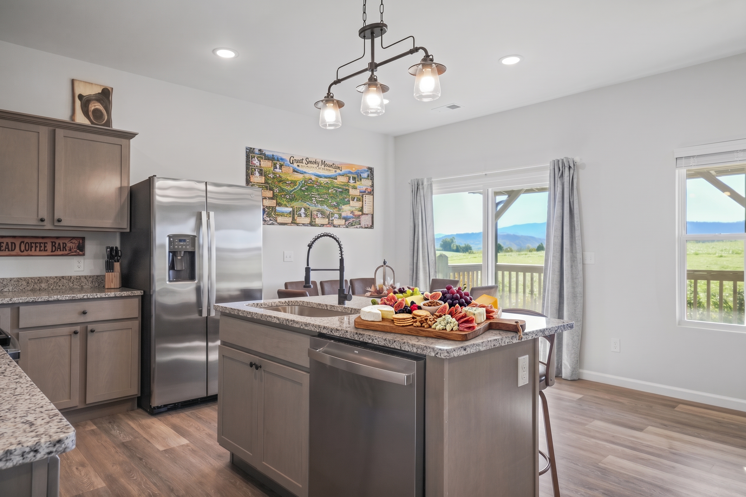 Bright modern kitchen with island seating and stunning mountain views