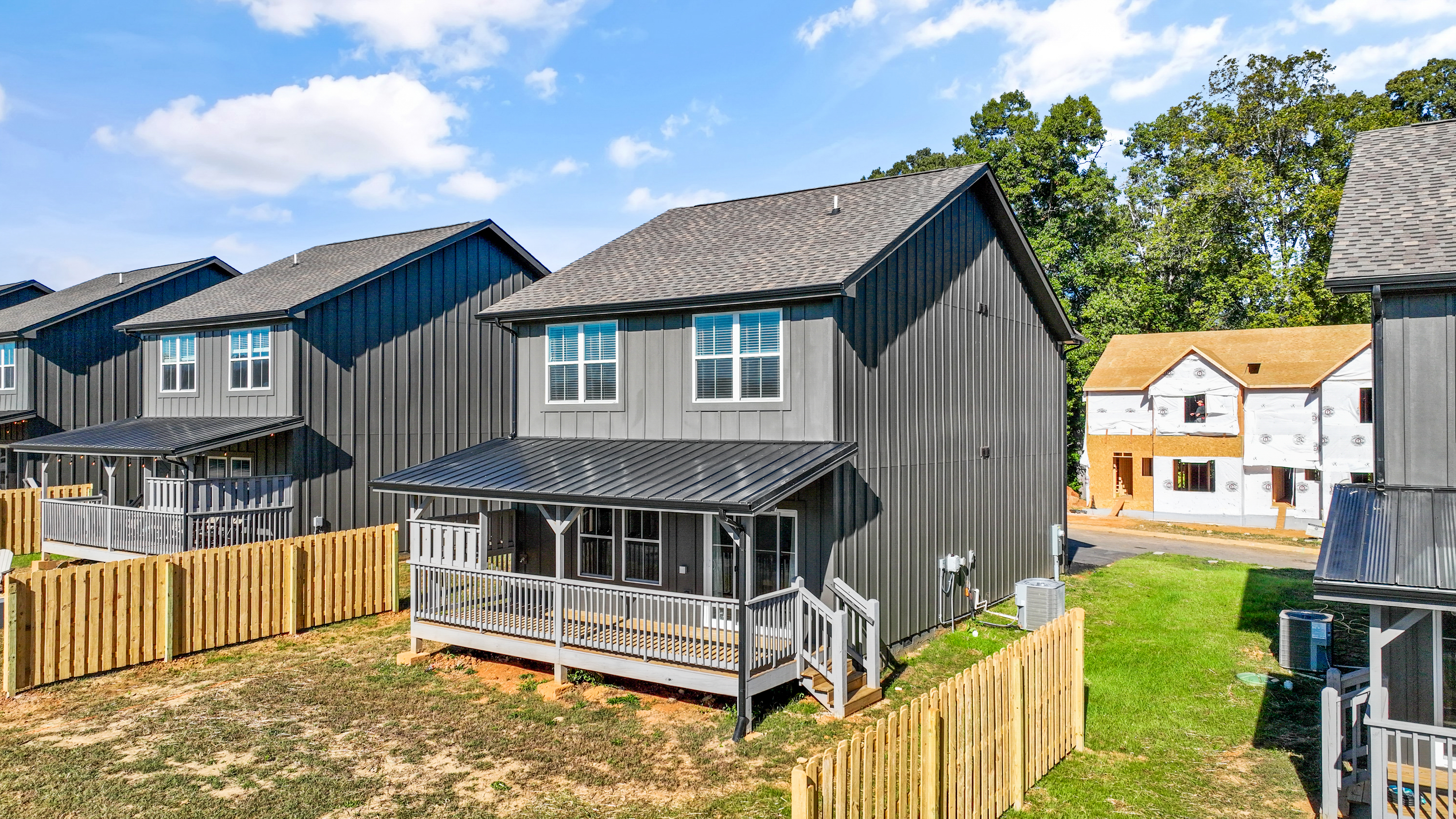 Modern home with covered porch and private fenced yard
