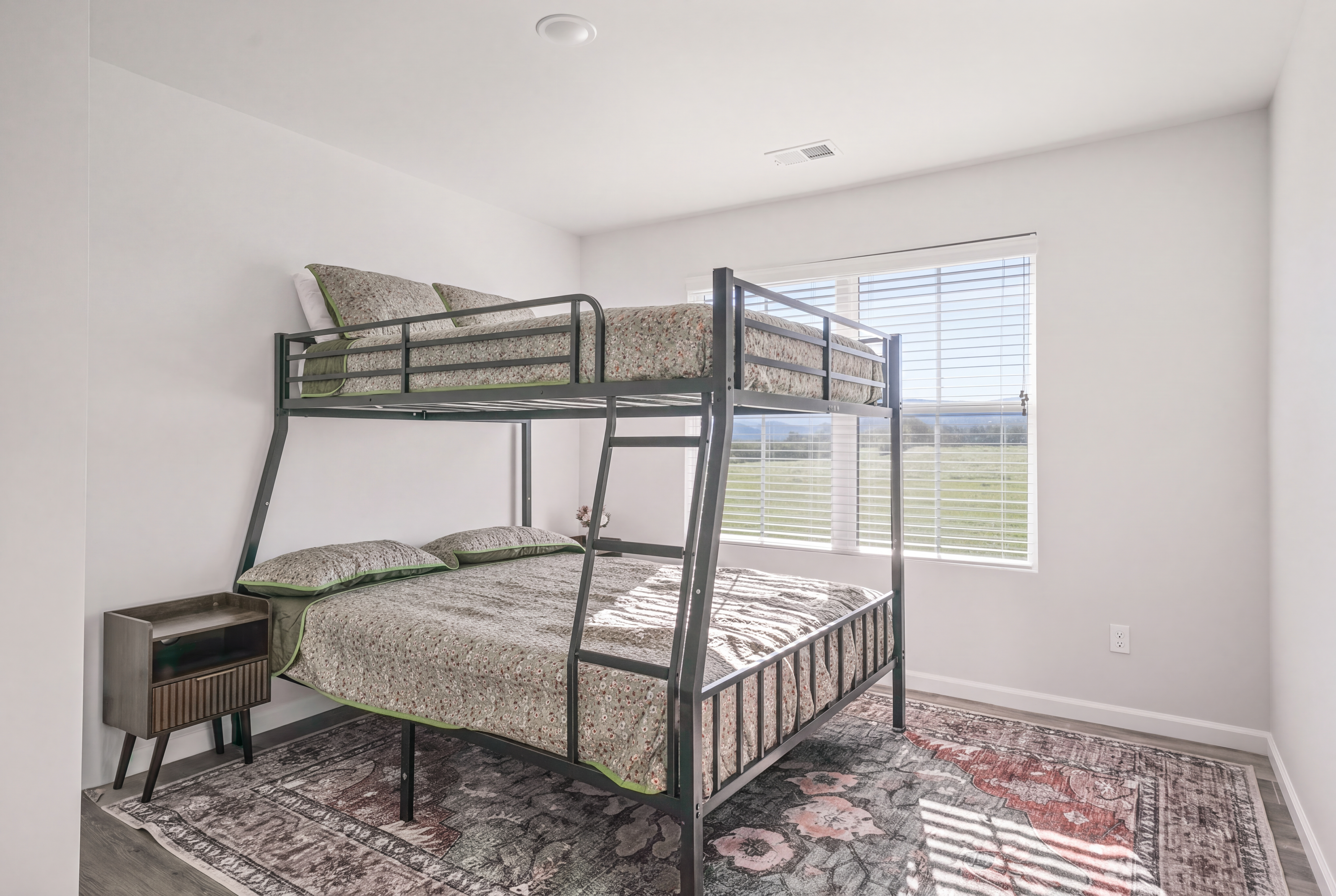 Bright bunk room with natural light—perfect for families or group stays