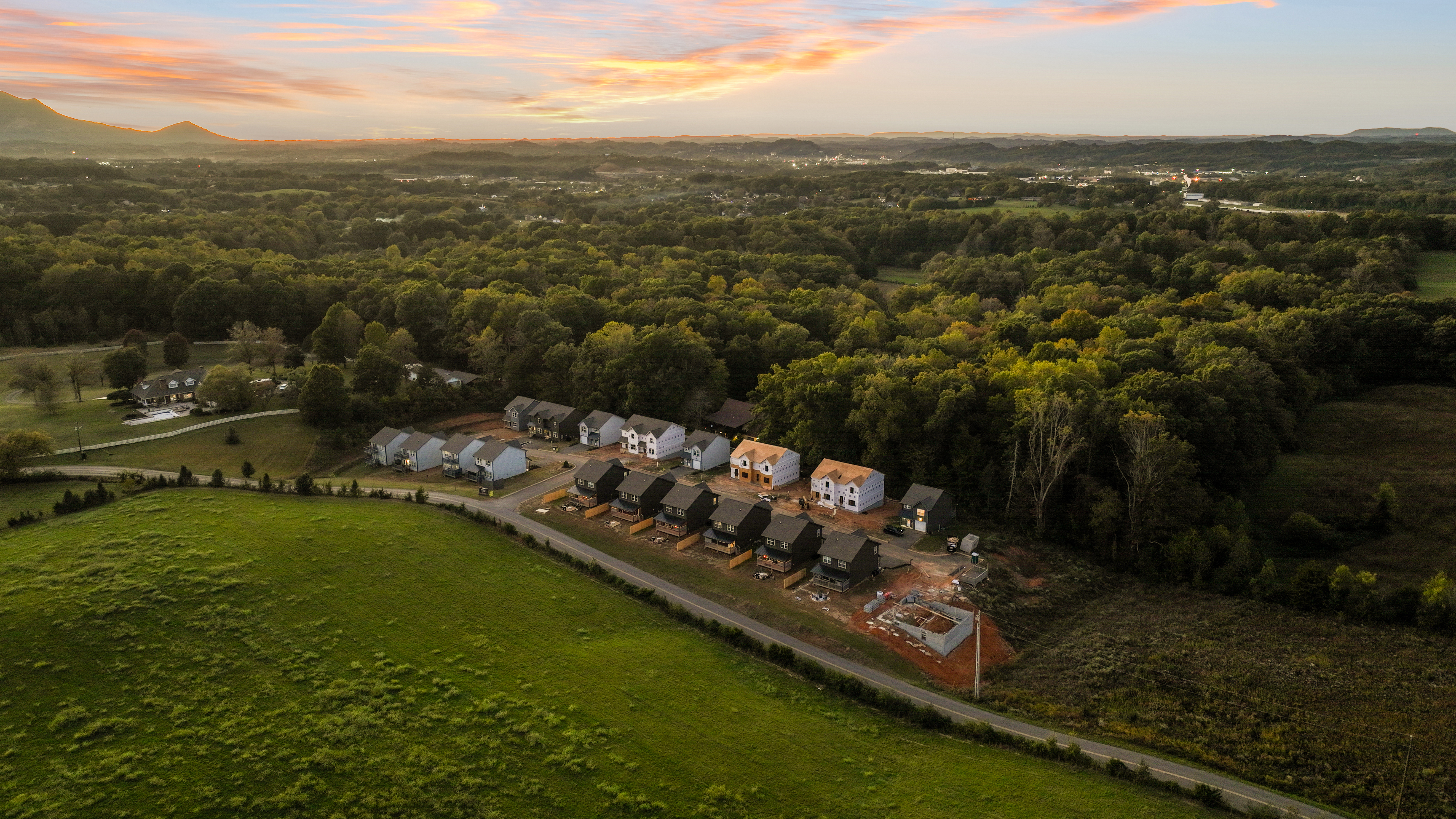 Scenic countryside homes with sunset views and peaceful wooded surroundings