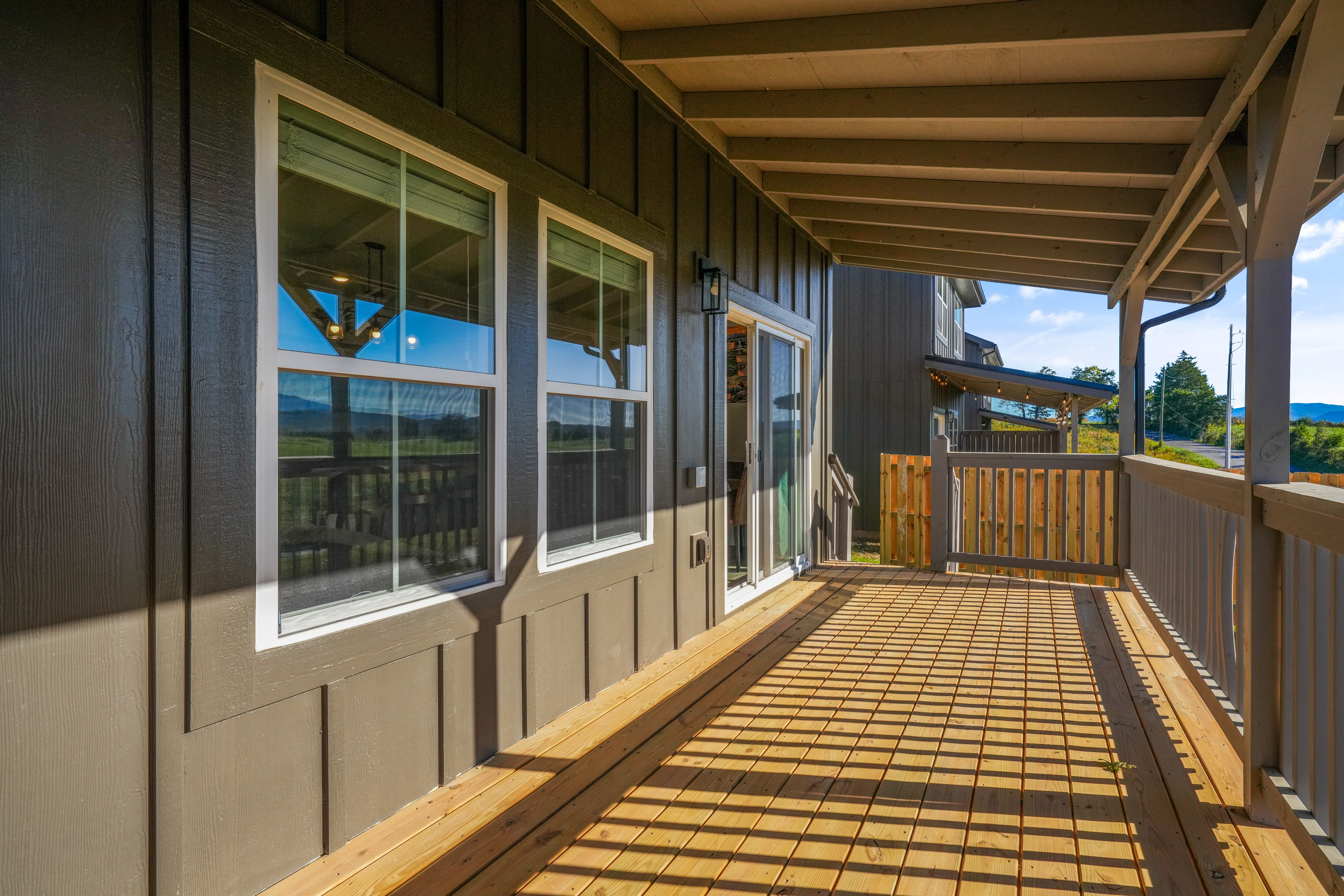 Spacious covered porch with private entry and room to relax outdoors