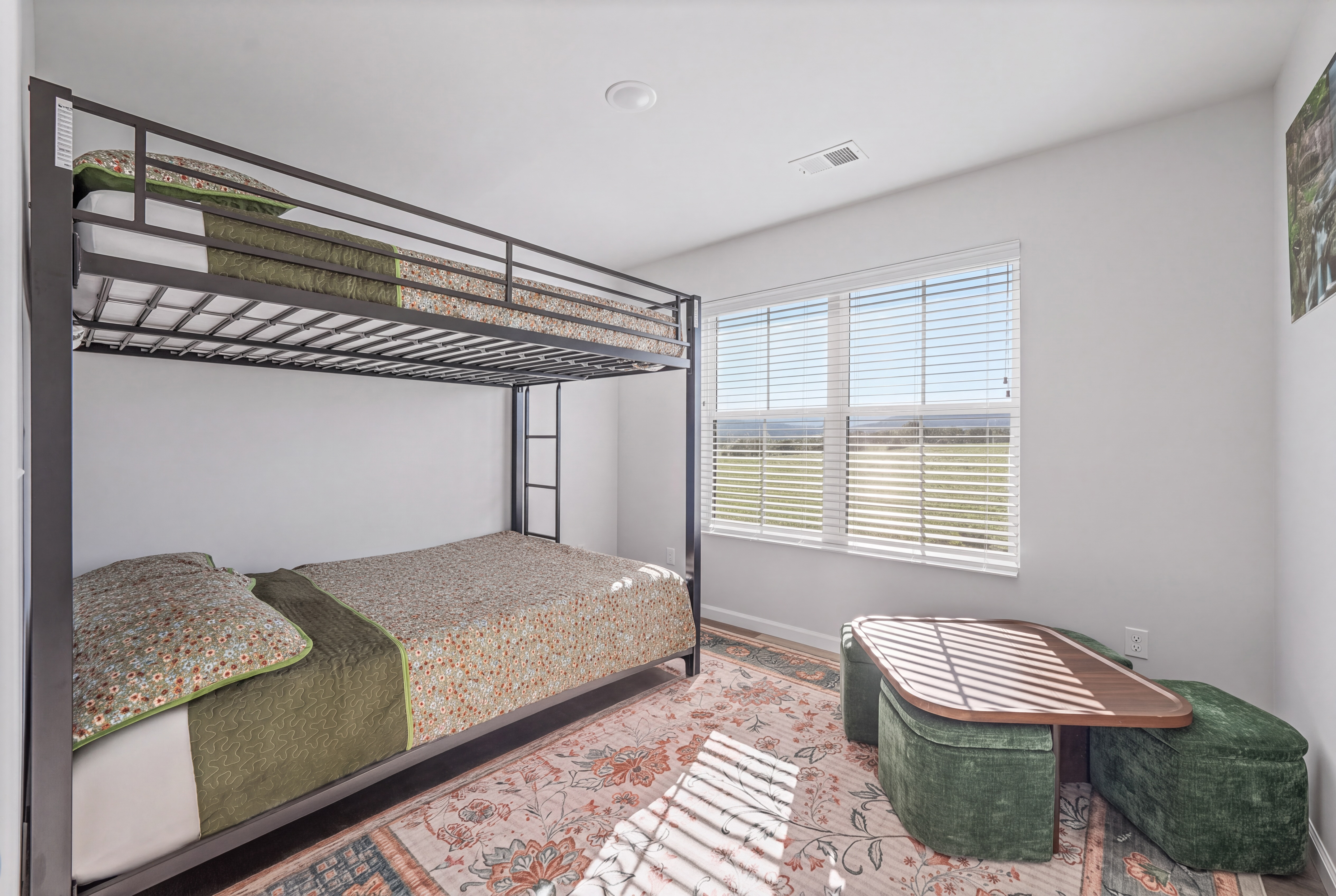 Bright bunk room with natural light, open views, and family-friendly sleeping space