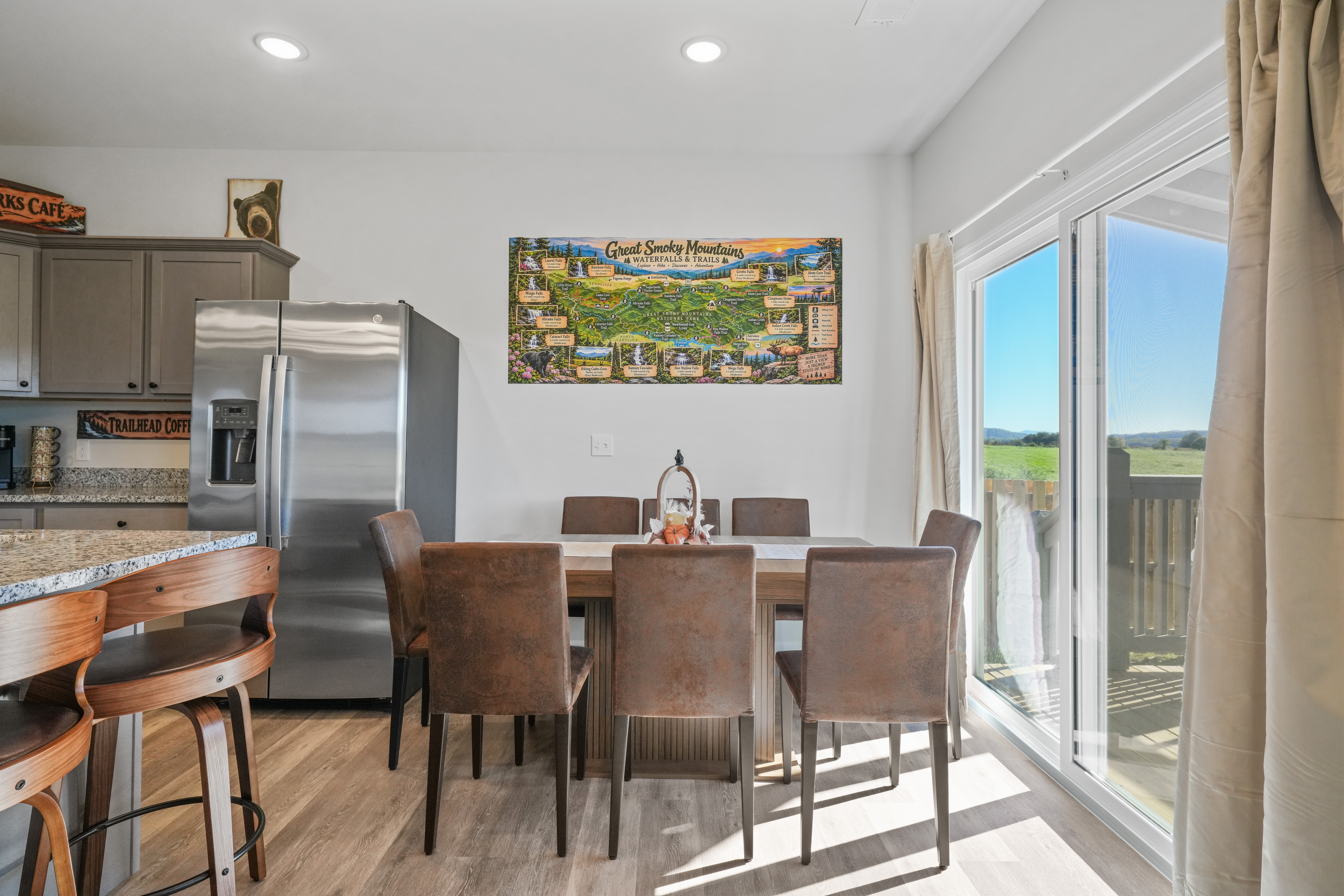 Sunny dining space with seating for 6 and scenic balcony views