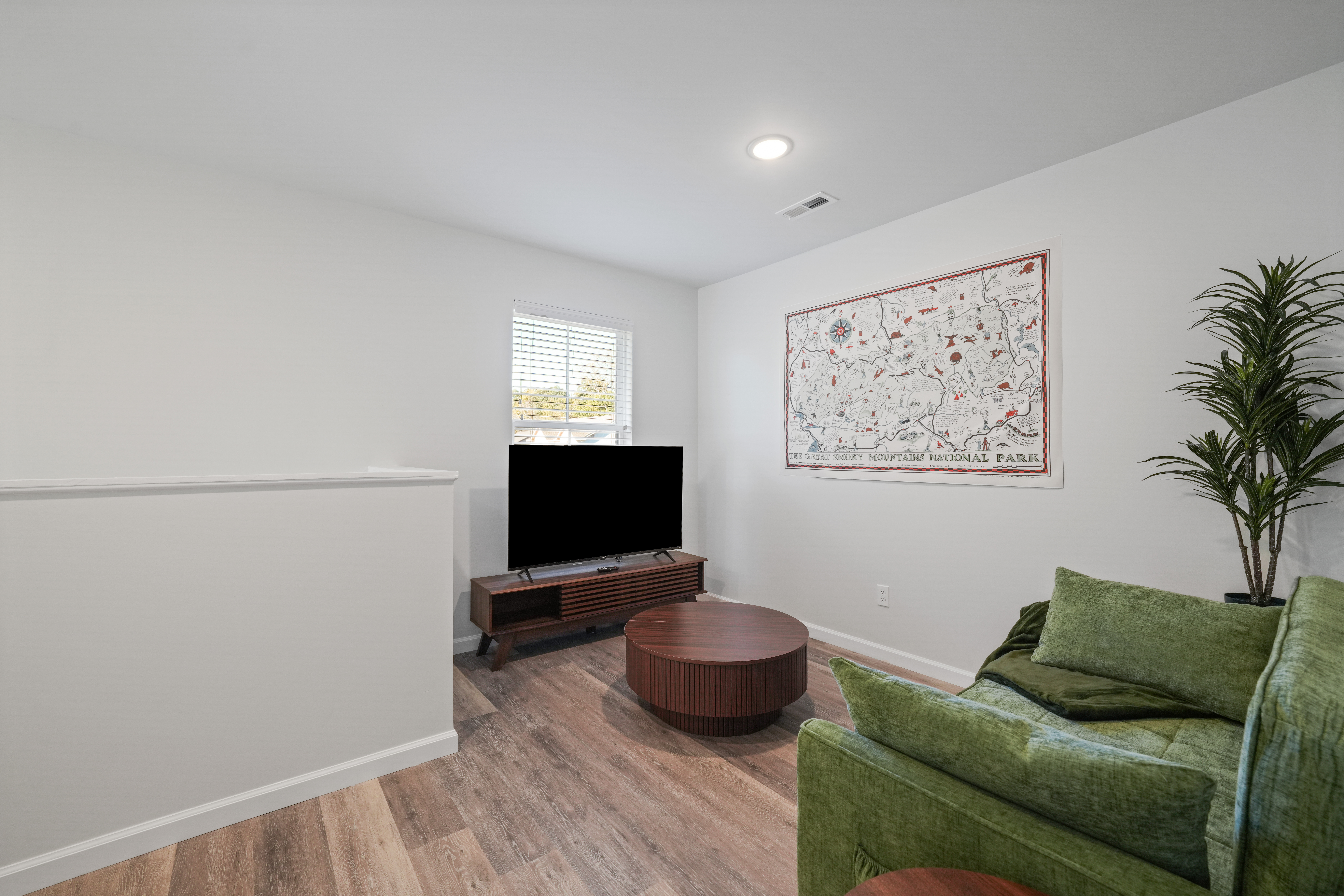 Cozy TV lounge with plush seating and stylish national park decor